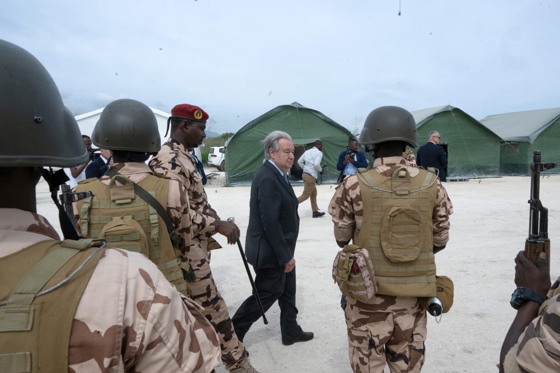 A photo of the UN Secretary-General António Guterres touring the base of the UN's Gang Suppression Force at Camp Vertières, in Port-au-Prince, Haiti