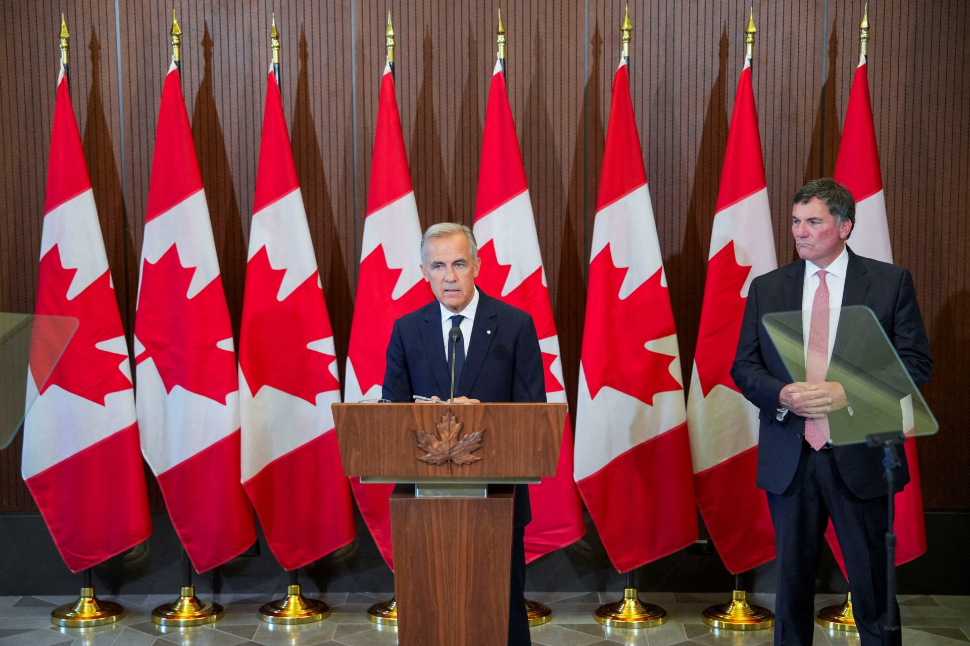 <p>Canada’s Prime Minister Mark Carney speaks with the news media after he suspended trade negotiations with the United States, in Ottawa, Ontario, Canada August 22, 2026.</p>
