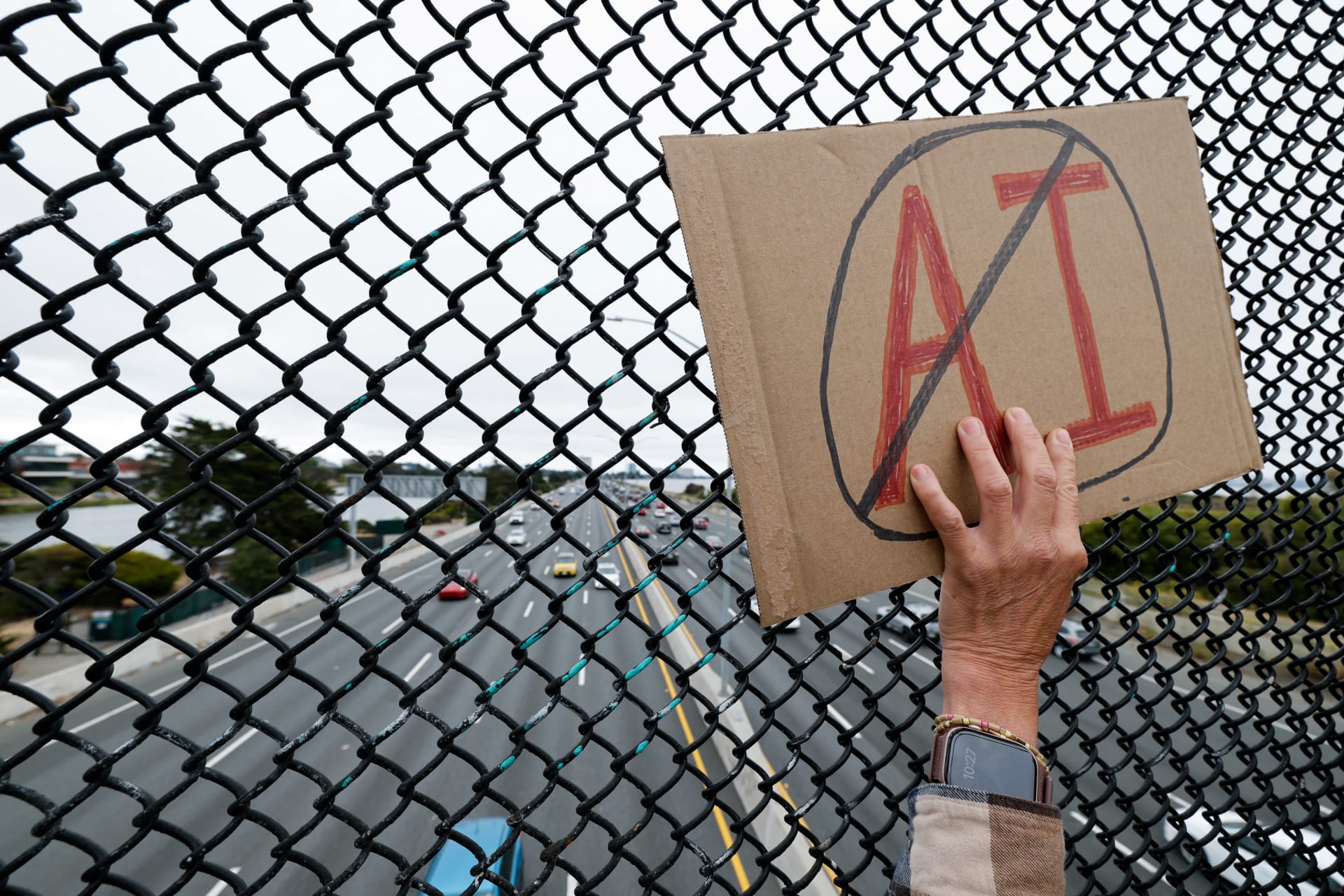 <p>A woman displays a sign as demonstrators participate in nationwide protests against data centers, in Berkeley, California, U.S., July 18, 2026. REUTERS/Fred Greaves</p>
