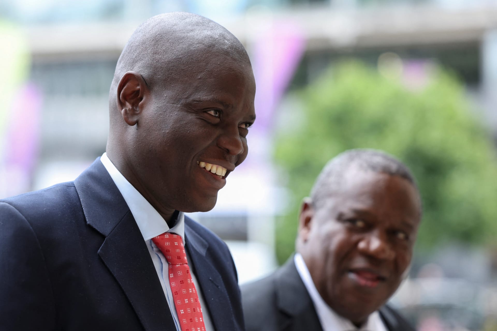 Jeremiah Nyamane Mamabolo, South Africa's high commissioner to the United Kingdom walks with South Africa's Minister of International Relations Ronald Lamola for a thanksgiving service on the 30th anniversary of South Africa's democracy, at Westminster Abbey in London