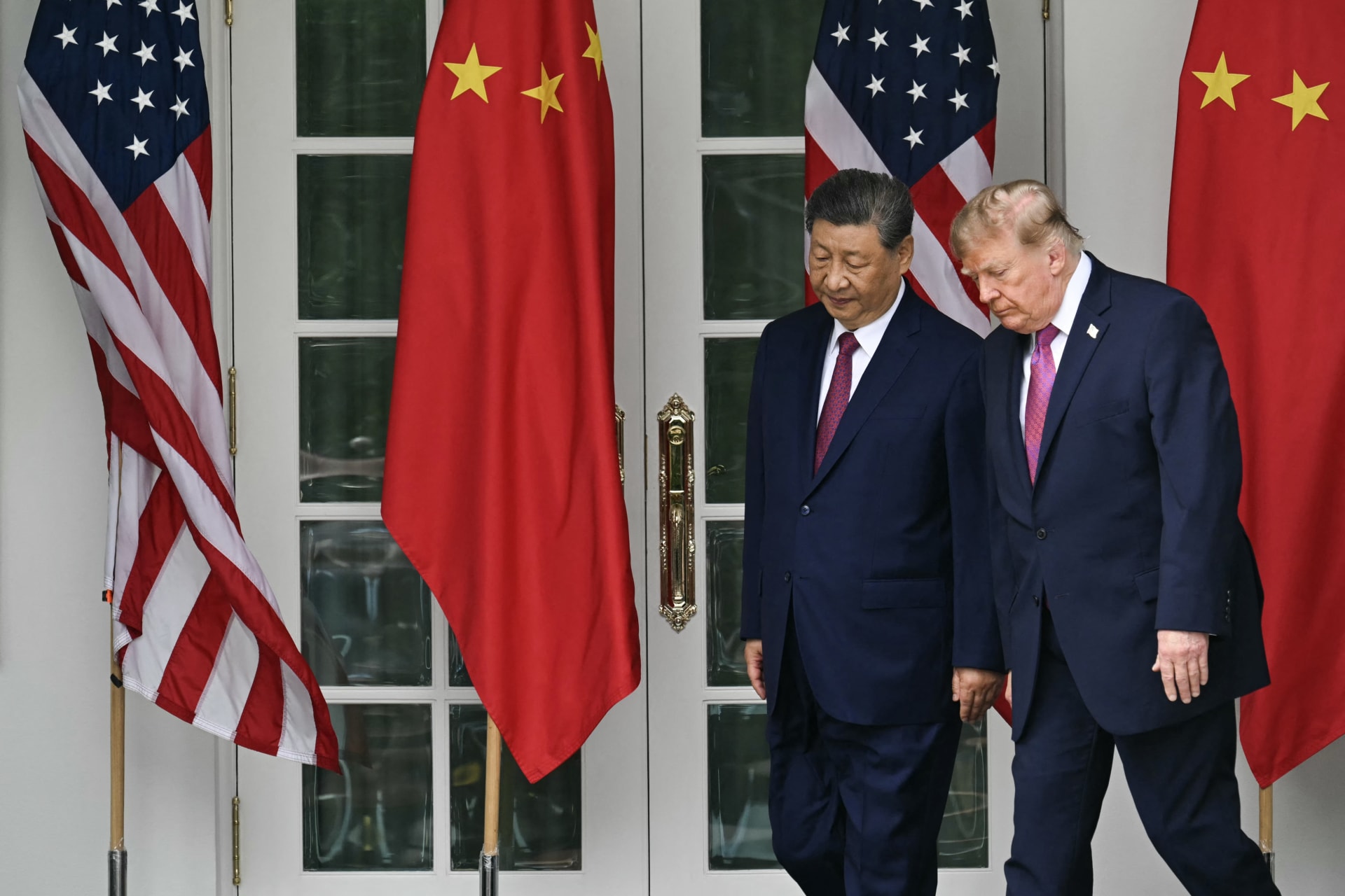 China's President Xi Jinping (L) and U.S. President Donald Trump arrive for a military review in the Rose Garden of the White House in Washington, DC, on September 24, 2026.