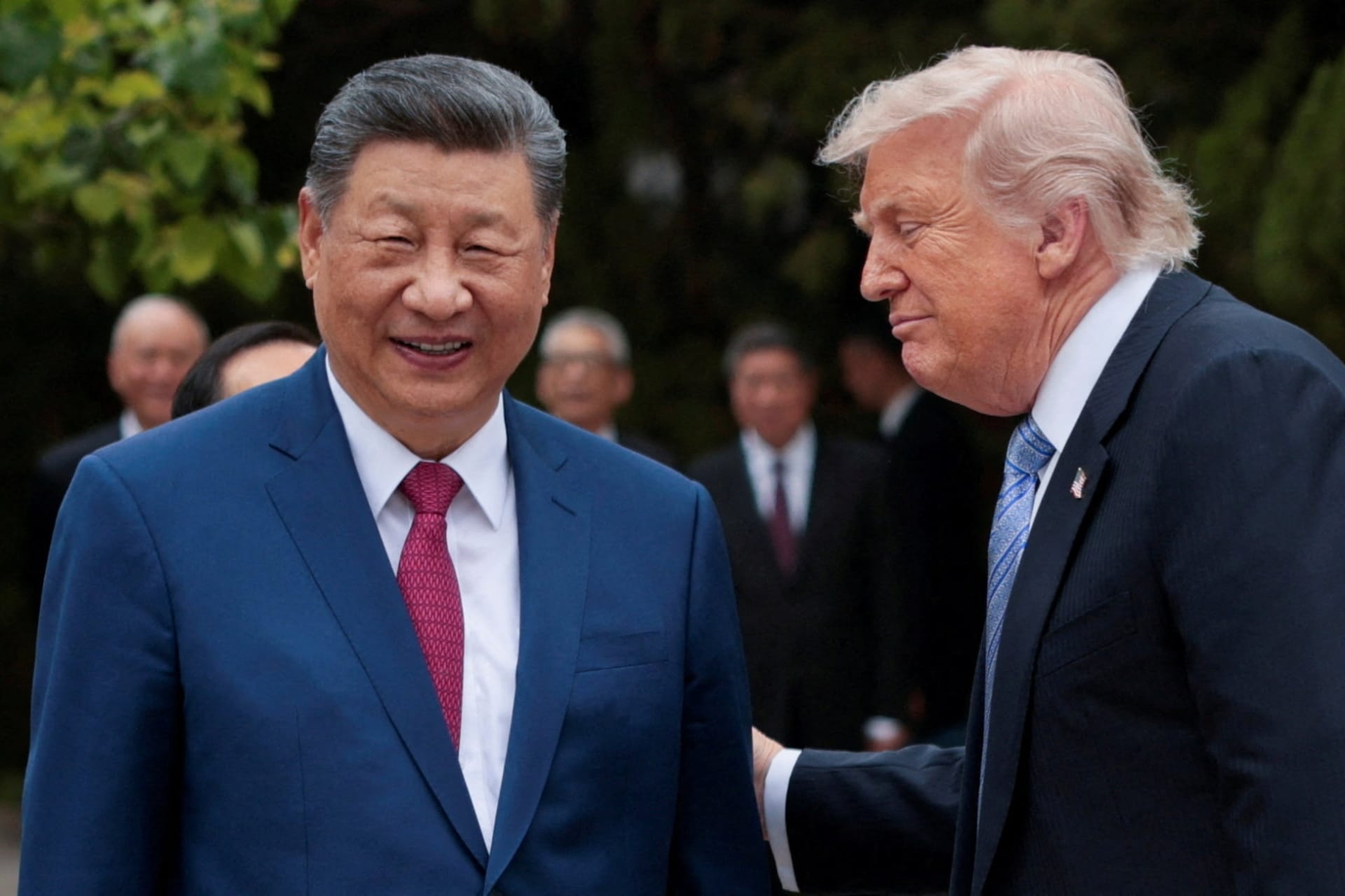 FILE PHOTO: U.S. President Donald Trump speaks with Chinese President Xi Jinping while leaving after a visit to the Zhongnanhai Garden in Beijing, China, May 15, 2026. REUTERS/Evan Vucci/Pool/File Photo