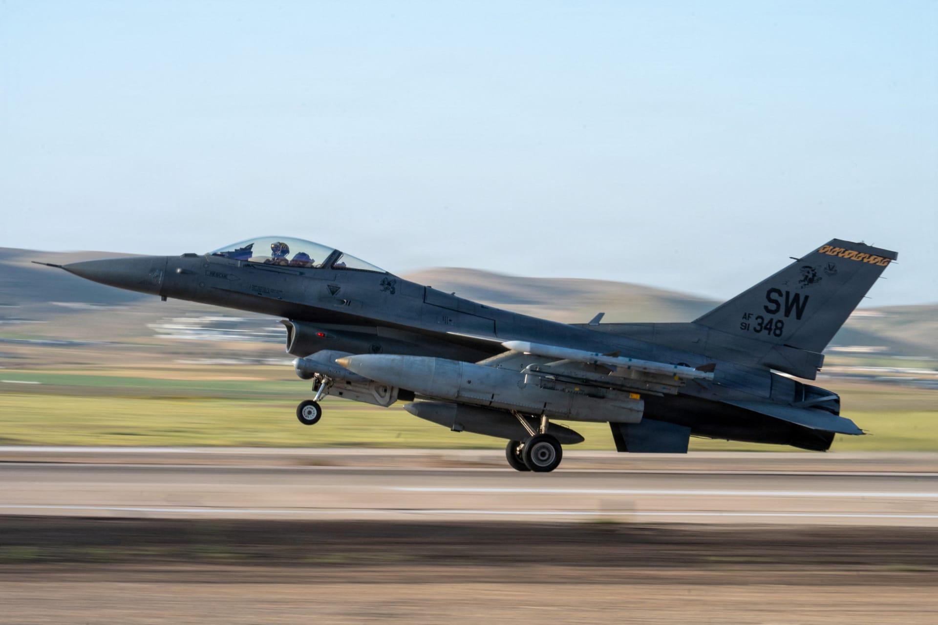 A U.S. Air Force F-16 Fighting Falcon lands at a base in the Middle East