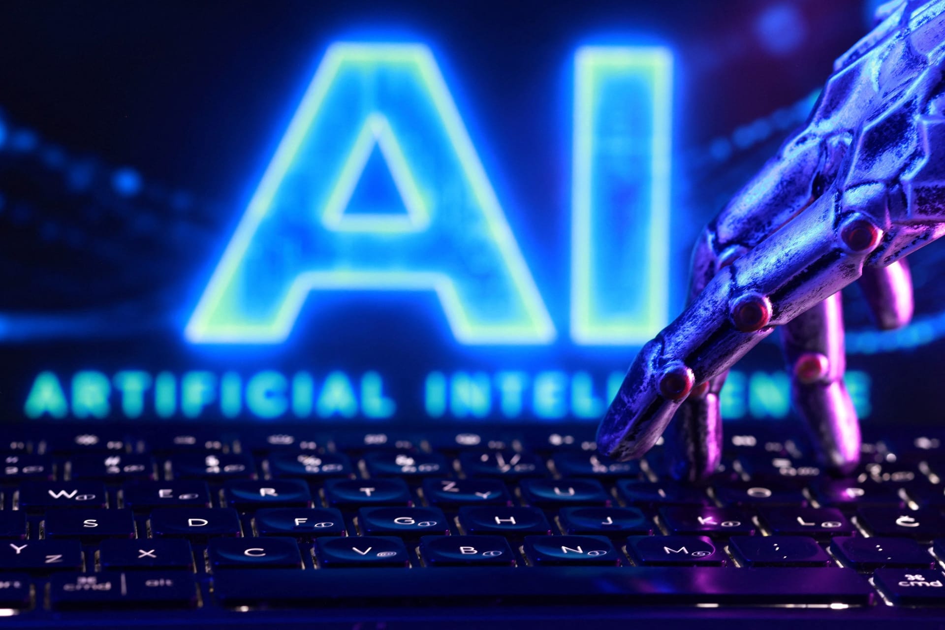 "AI Artificial Intelligence" words, a keyboard and a robotics hand in this illustration taken, September 23, 2026. REUTERS/Dado Ruvic/Illustration