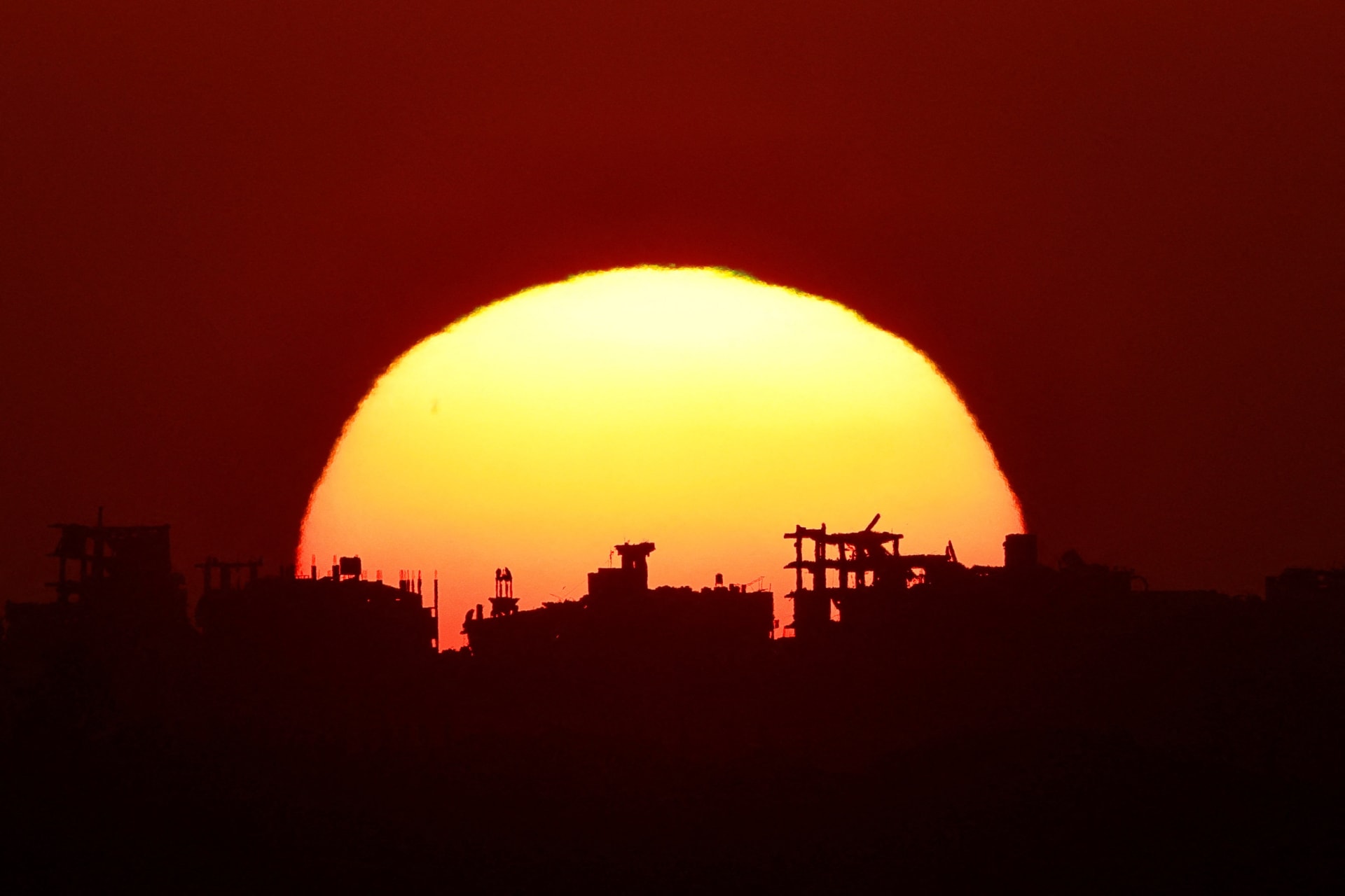 <p>The sun sets over Gaza, as seen from the Israeli side of the border, on September 1, 2026.</p>
