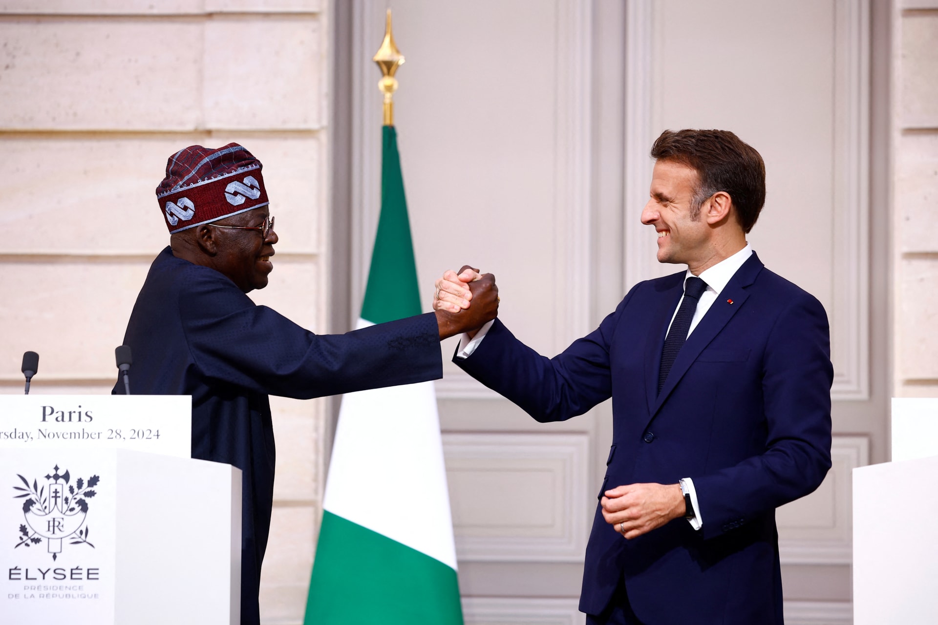 <p>French President Emmanuel Macron shakes hands with Nigerian President Bola Ahmed Tinubu after they delivered statements to the press following a meeting at the Elysee Palace in Paris as part of his two-day state visit to France, on November 28, 2024.</p>
