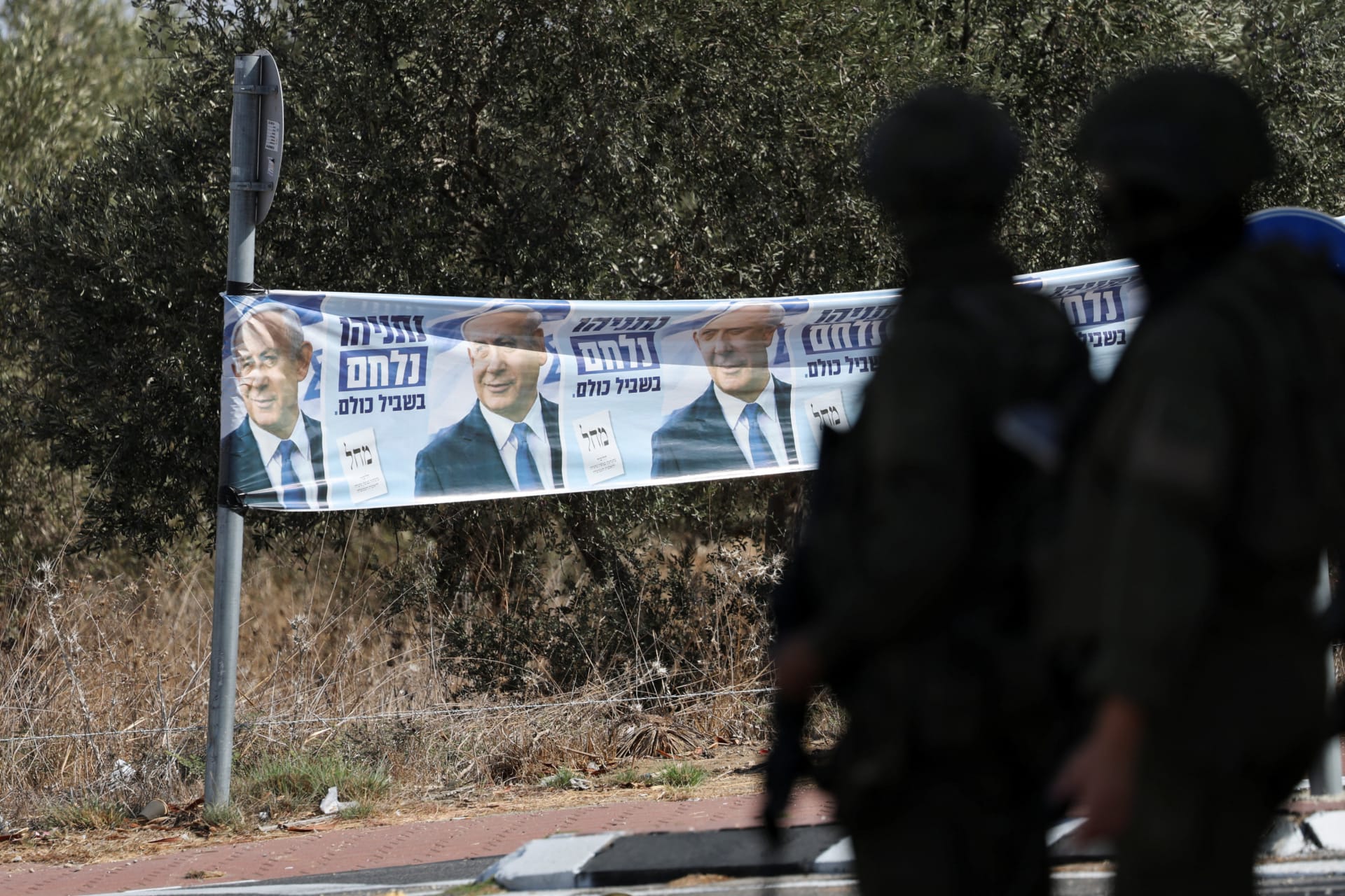 An election banner featuring Israeli Prime Minister Benjamin Netanyahu is displayed near Palestinian-owned olive groves in the village of Rantes near Ramallah, in the Israeli-occupied West Bank, October 6, 2026.