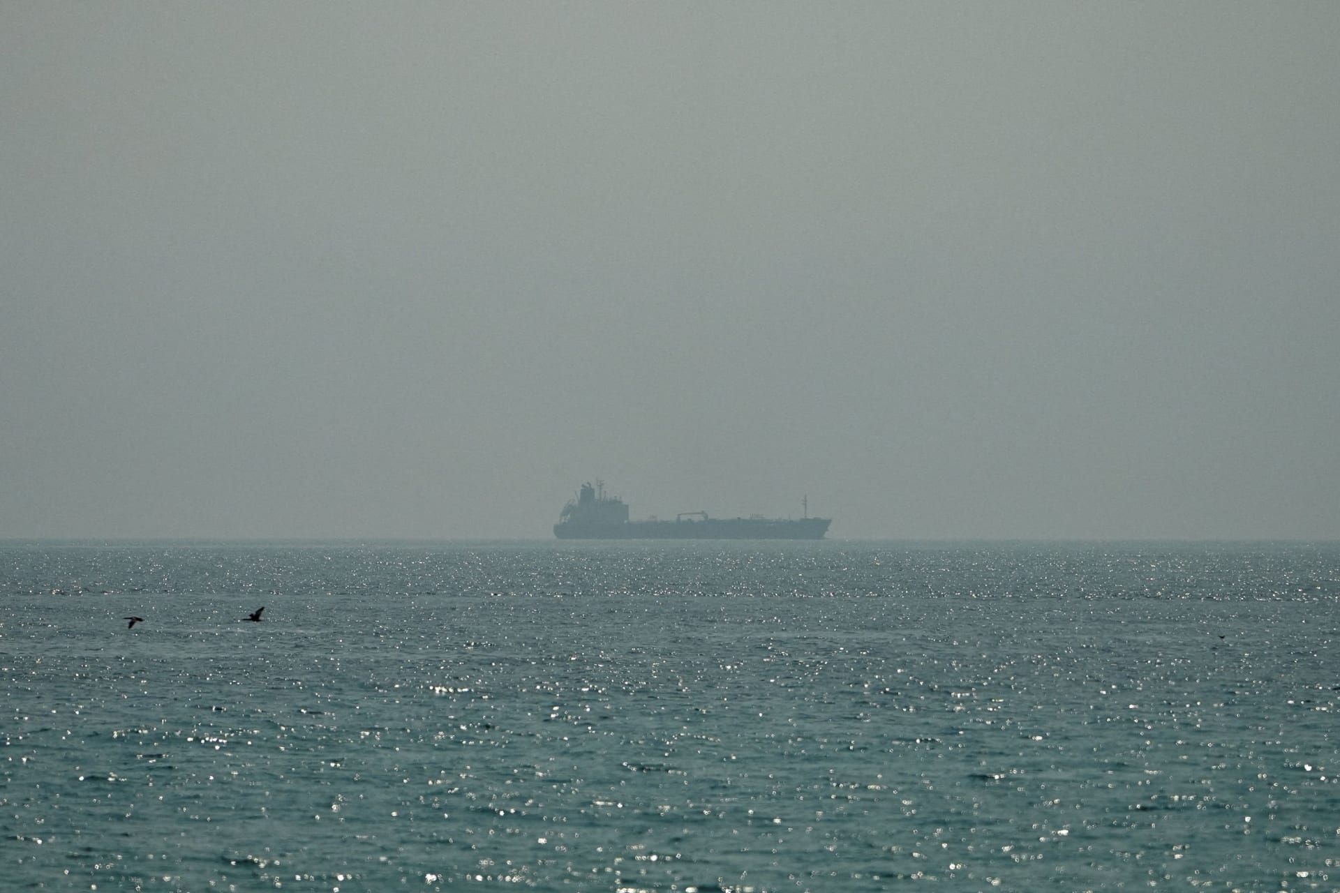 An oil tanker sails at sea near the Omani coast, as seen from Musandam, Oman, June 26, 2026.