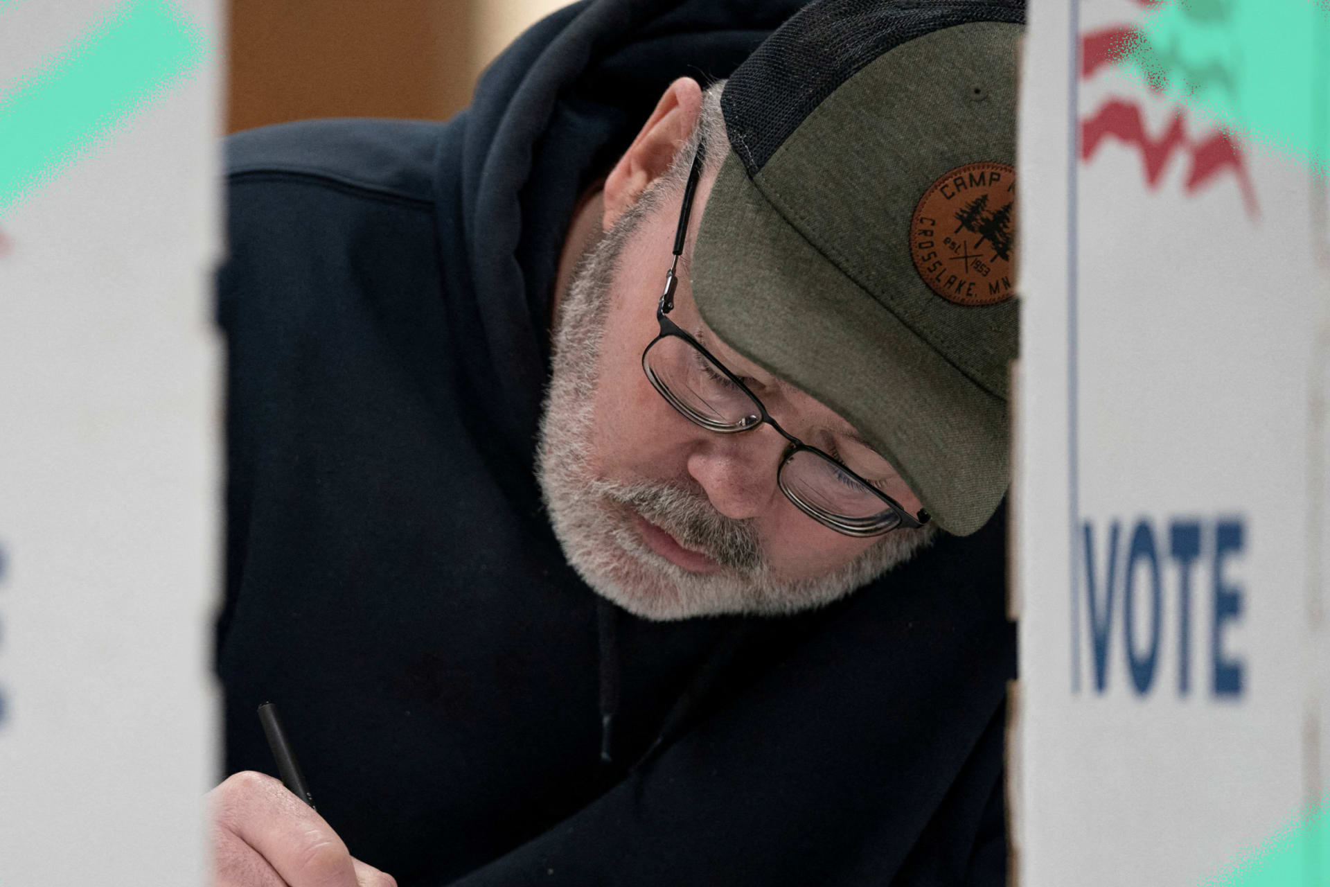 A voter casts a ballot at a polling place in Douglas County, Wisconsin, on April 2, 2024.