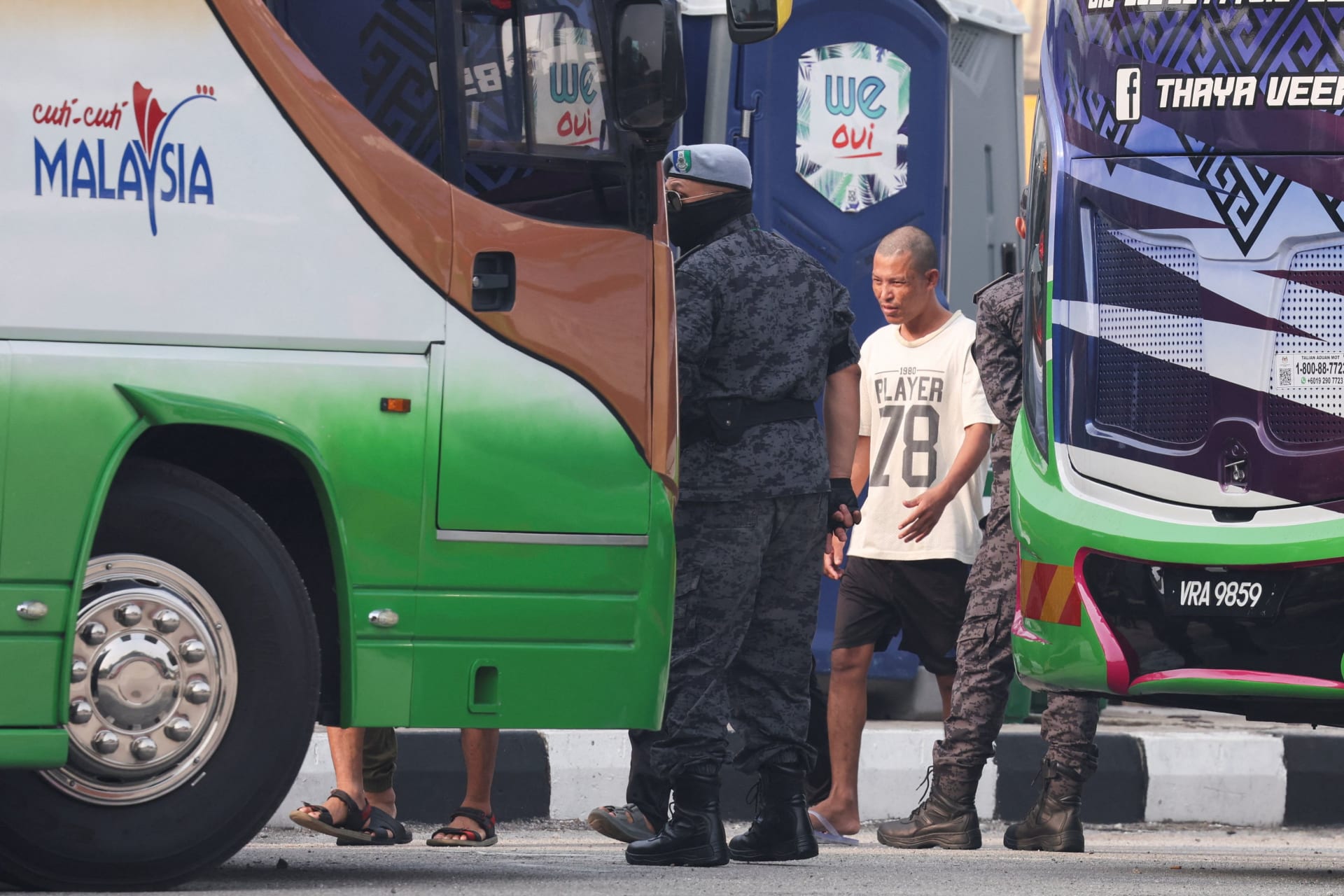 A Myanmar national due to be repatriated from Malaysia stands at Lumut, Malaysia, September 29, 2026.