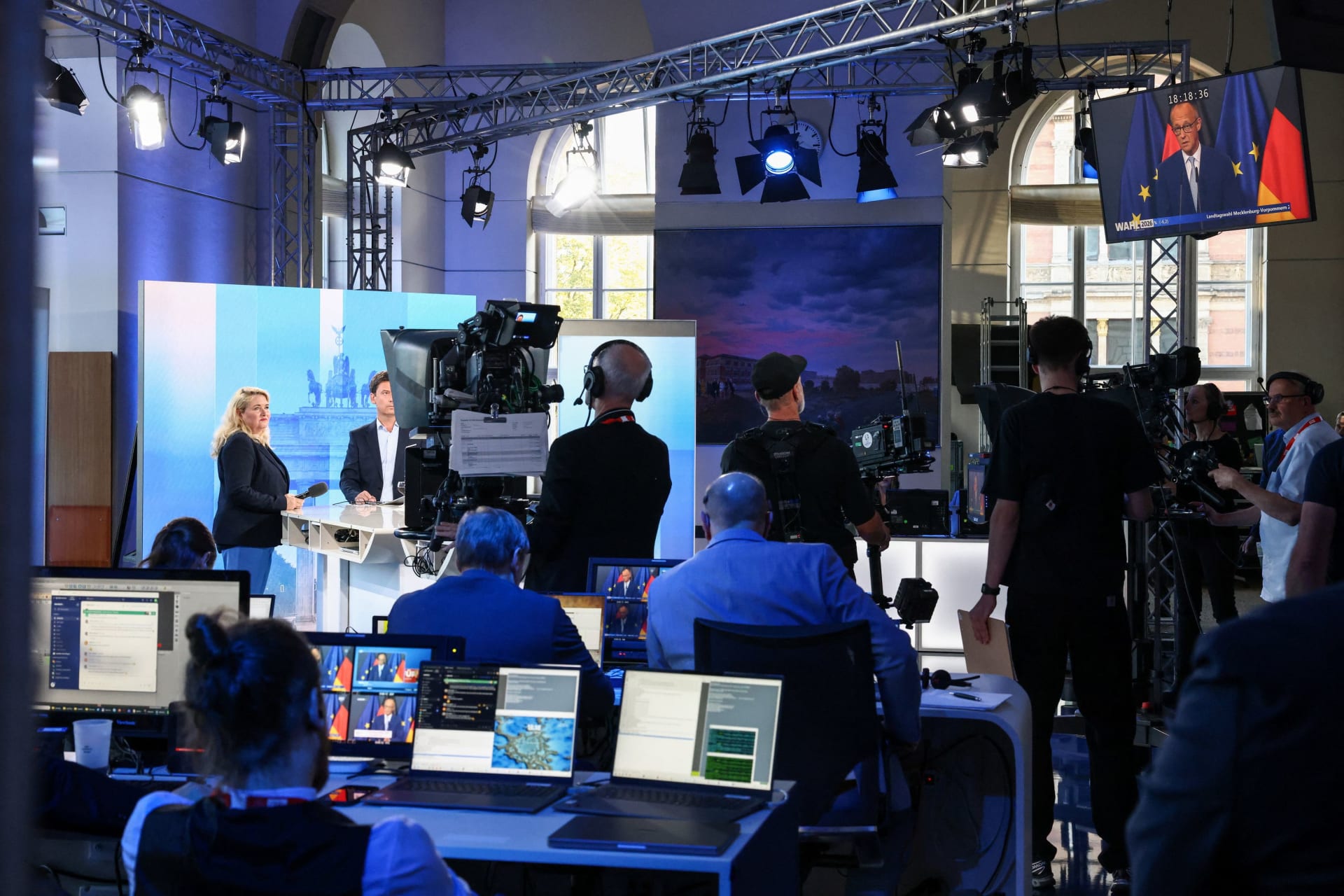 A screen at a RBB TV studio shows German Chancellor Friedrich Merz delivering a speech during a live broadcast, following the first exit polls after voting ended in the Berlin state election, in Berlin, Germany, September 20, 2026.