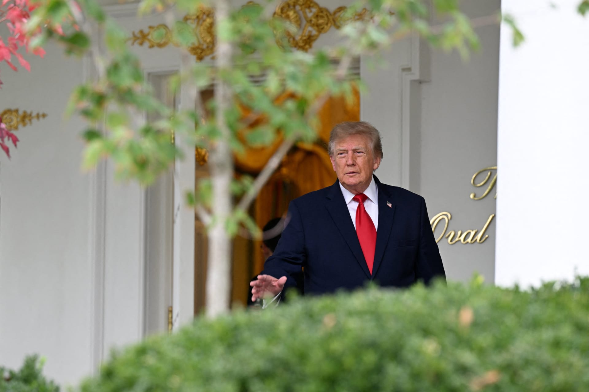 U.S. President Donald Trump gestures as he hosts a Rose Garden lunch at the White House.