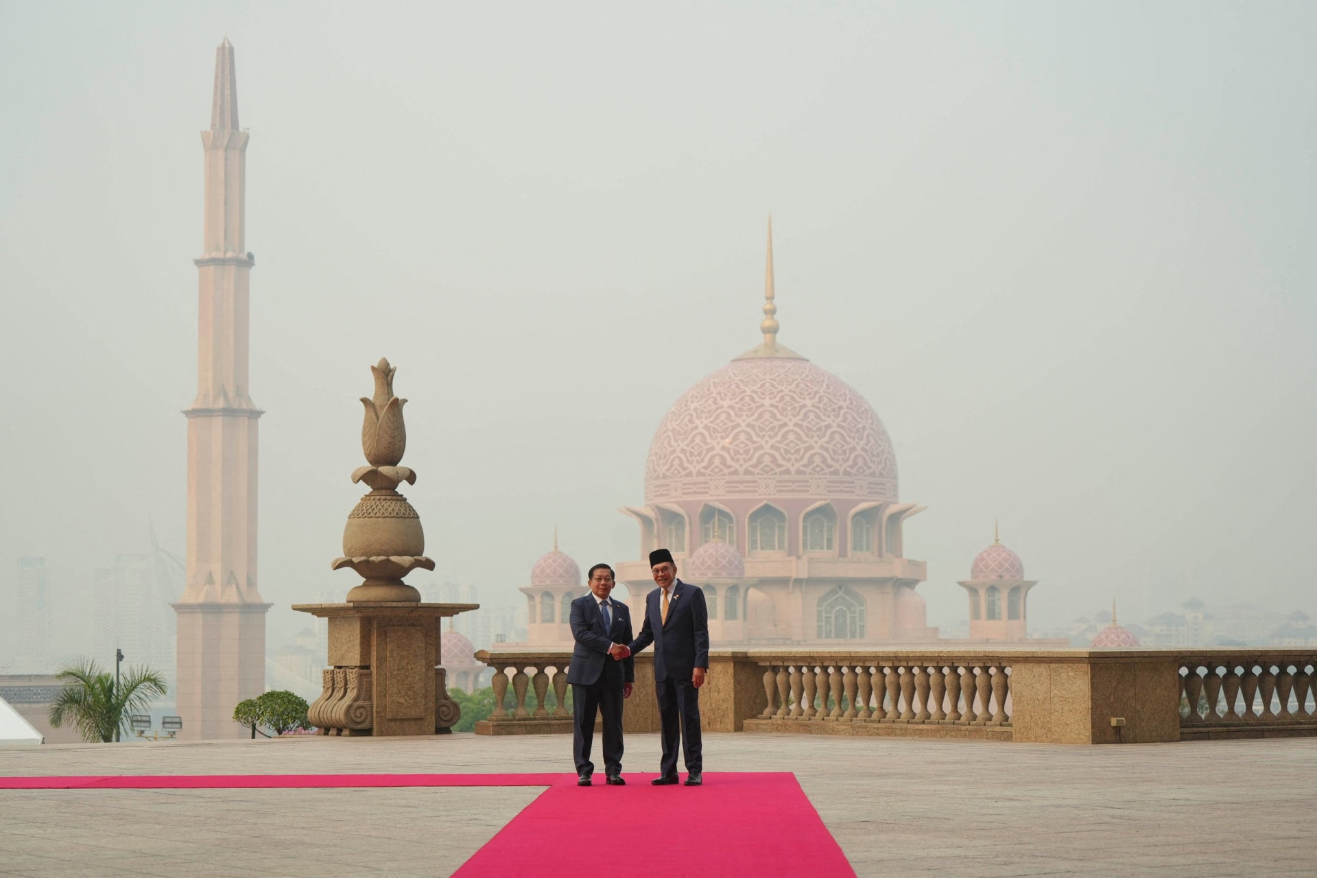 Myanmar’s President Min Aung Hlaing shakes hands with Malaysia’s Prime Minister Anwar Ibrahim during their meeting at the Prime Minister’s Office in Putrajaya, Malaysia, Thursday, Oct. 8, 2026.