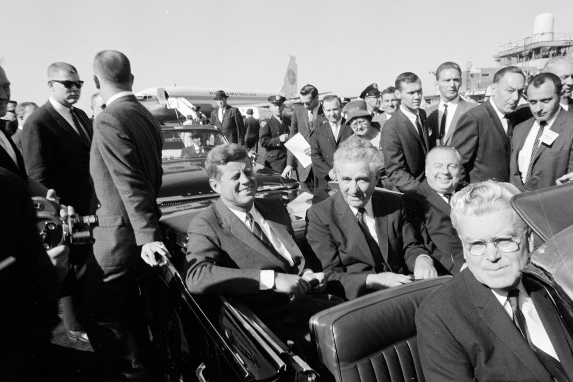 <p>President John F. Kennedy upon arrival at Cleveland Hopkins Airport in Cleveland, Ohio, with Senator Frank Lausche and Governor Michael V. DiSalle in the back seats and Representative Michael J. Feighan in the front seat, October 19, 1962.</p>
