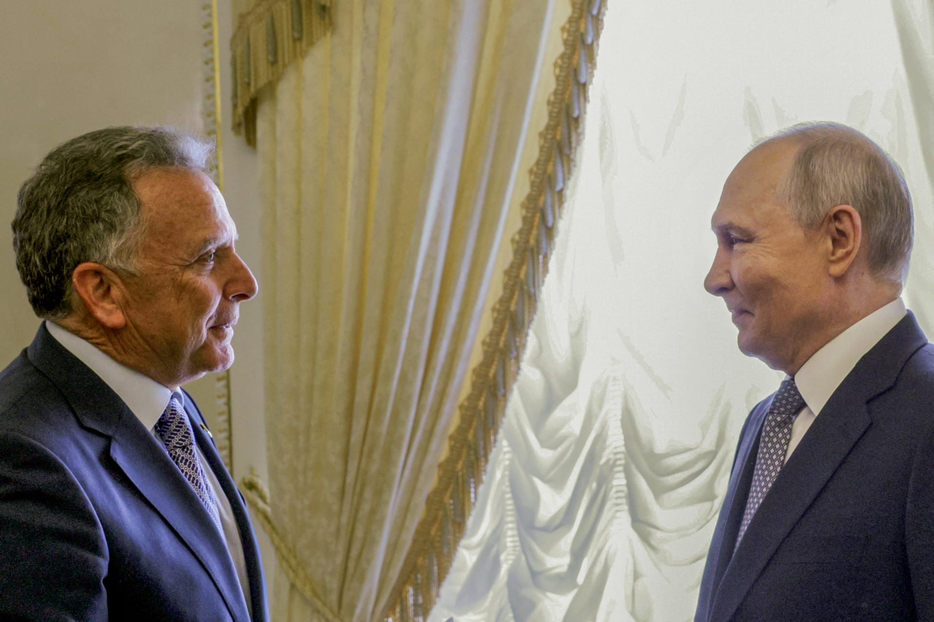 In this pool photograph distributed by the Russian state agency Sputnik, Russia's President Vladimir Putin greets US special envoy Steve Witkoff during their meeting in Saint Petersburg on October 21, 2026.