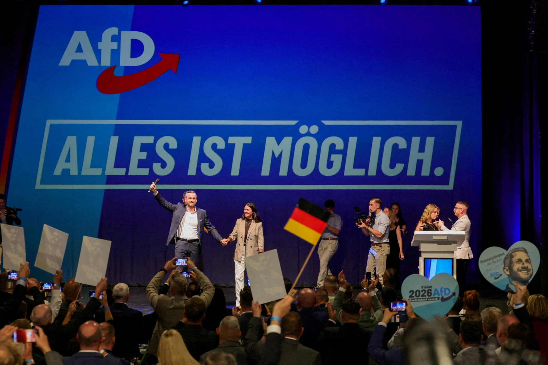 FILE PHOTO: Top candidate of the far-right Alternative for Germany (AfD) Ulrich Siegmund and his wife Julia Siegmund take the stage at the AfD election party after polls closed in the Saxony-Anhalt state elections and exit polls were announced, in Magdeburg, Germany, September 6, 2026. REUTERS/Fabrizio Bensch/File Photo