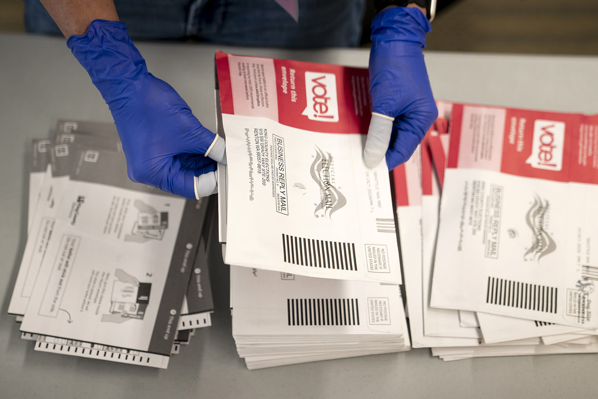 An election worker opens voter ballots for the midterm elections at the King County Elections headquarters on October 23, 2026 in Renton, Washington. Workers have already begun processing ballots in Washington, which uses mail-in voting. (Photo by David Ryder/Getty Images)