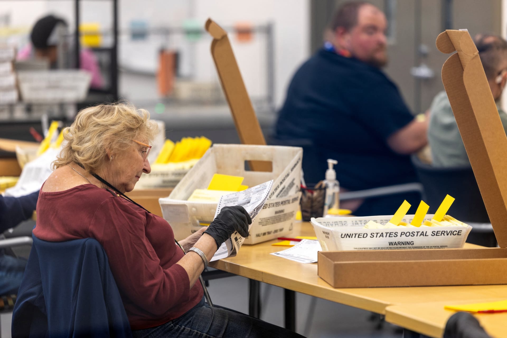<p>&nbsp;</p>
<p>Election workers extract ballots as they process mail-in ballots at the Registrar of Voters facility in San Diego, California, October 23, 2026.</p>
