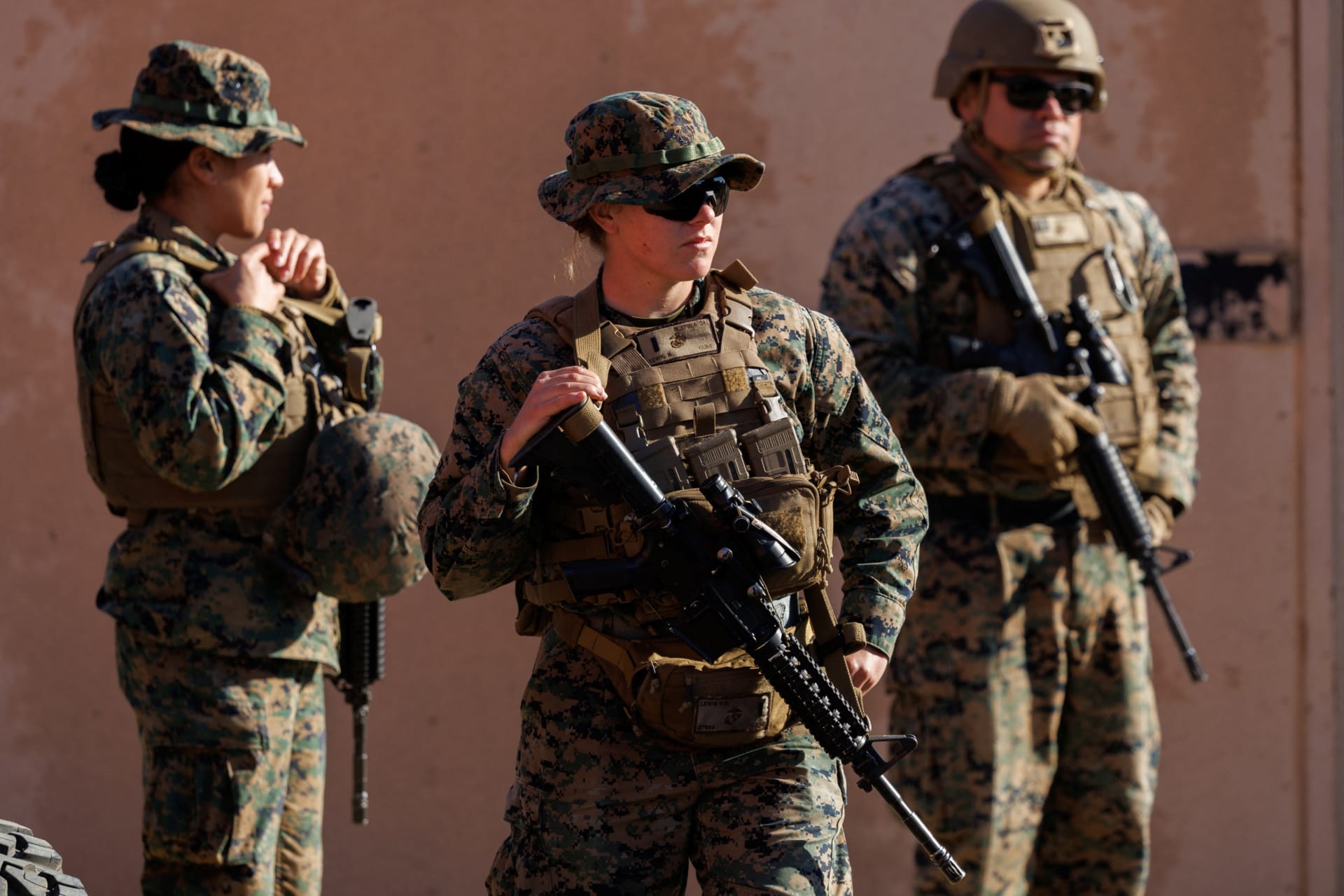 Three soldiers holding guns