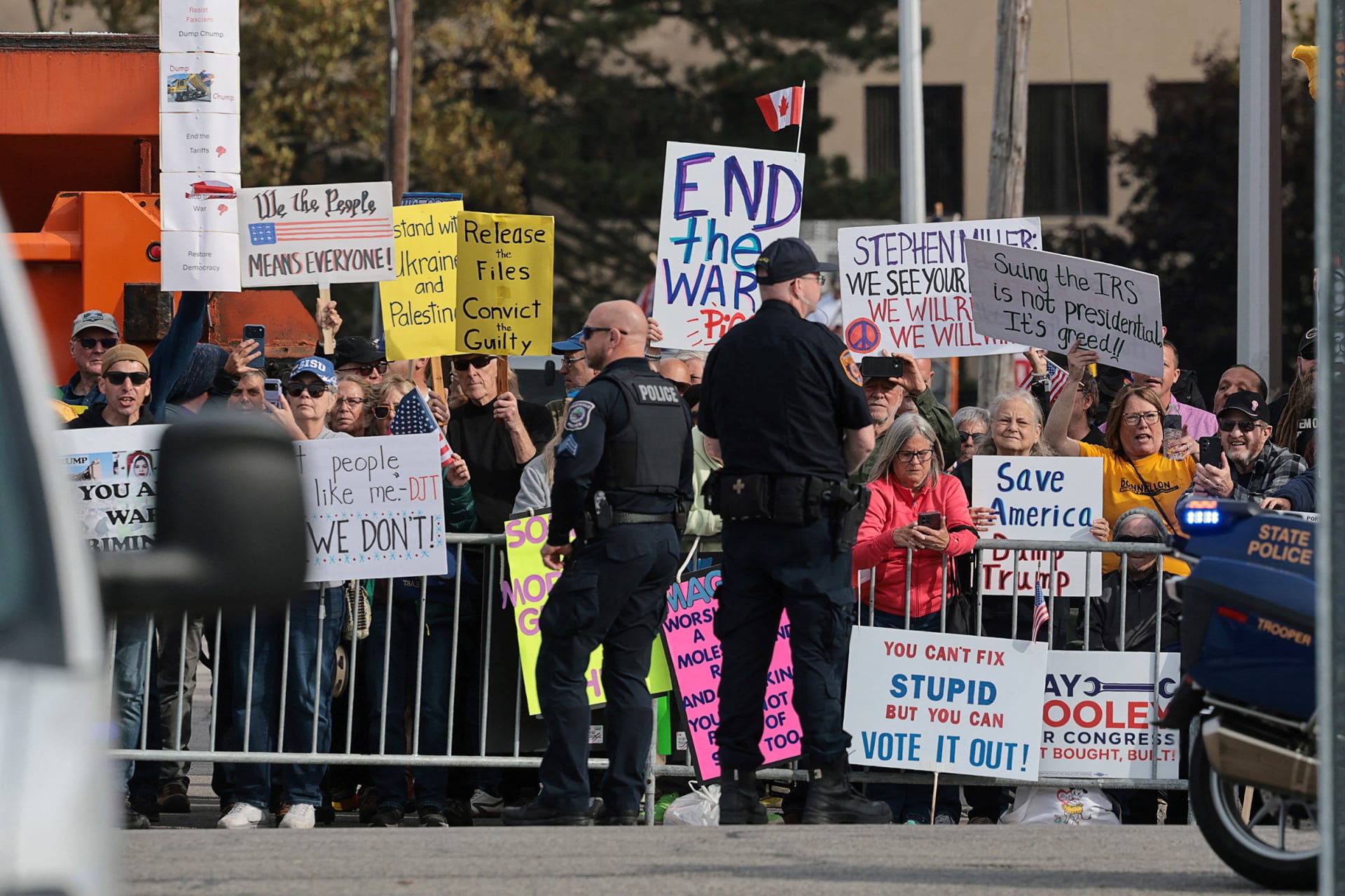 <p>Protesters demonstrate as President Donald Trump’s motorcade travels to an entertainment complex in Port Huron, Michigan, October 25, 2026.</p>

