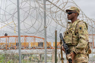 <p>A member of the National Guard patrols the southern U.S. border in Eagle Pass, Texas.</p>
