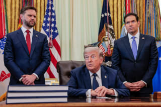 U.S. President Donald Trump speaks in the Oval Office, with Vice President JD Vance and Secretary of State Marco Rubio standing behind him, at the White House in Washington, D.C., U.S., on April 23, 2026.