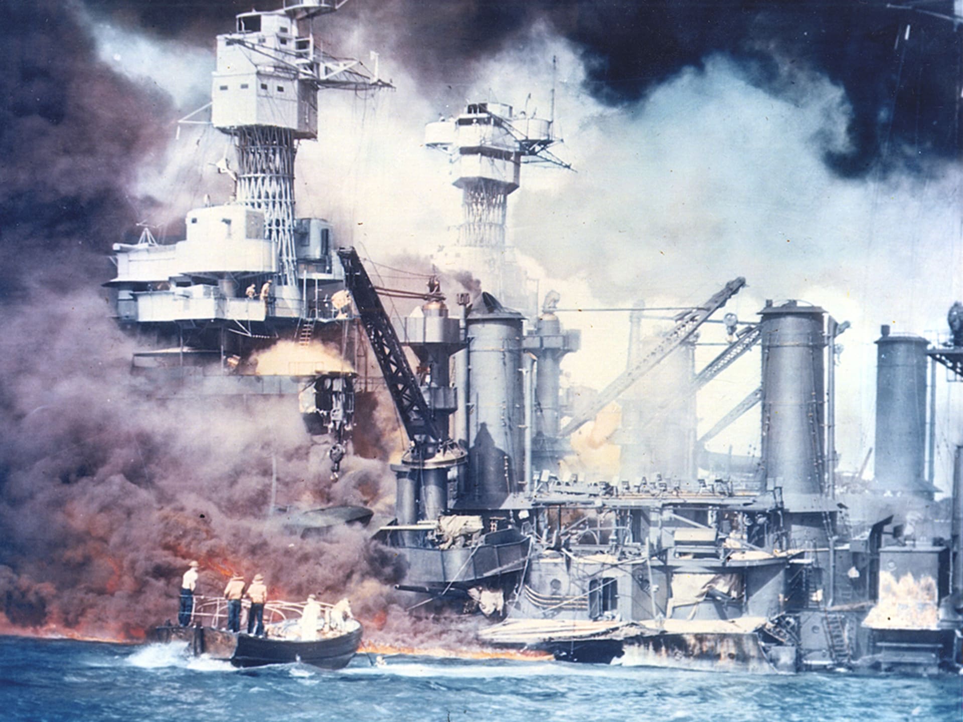 U.S. warships burn following the Japanese surprise attack on Pearl Harbor, Hawaii, on December 7, 1941. 
