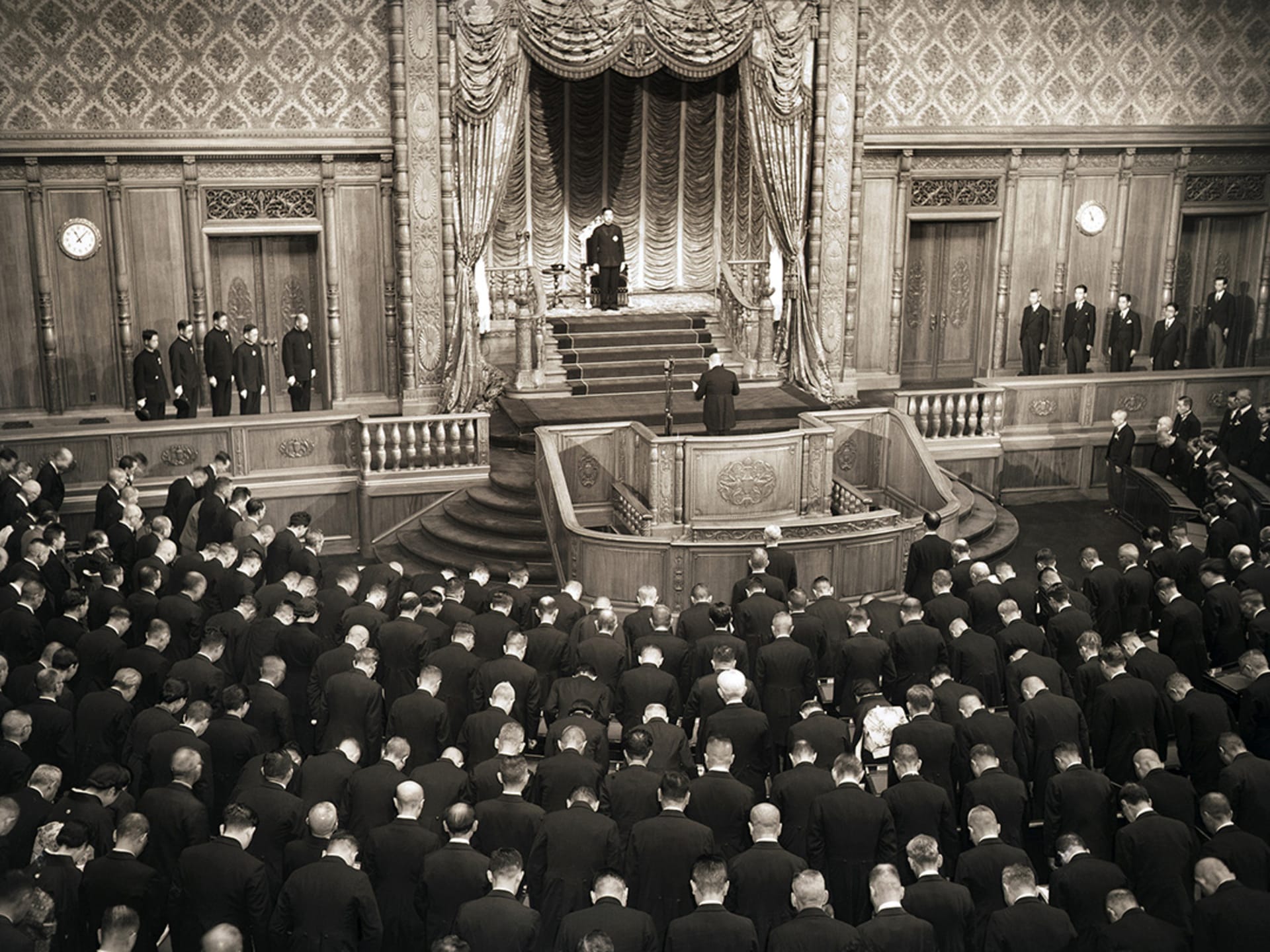 Emperor Hirohito stands before the Japanese Diet to endorse the new constitution.