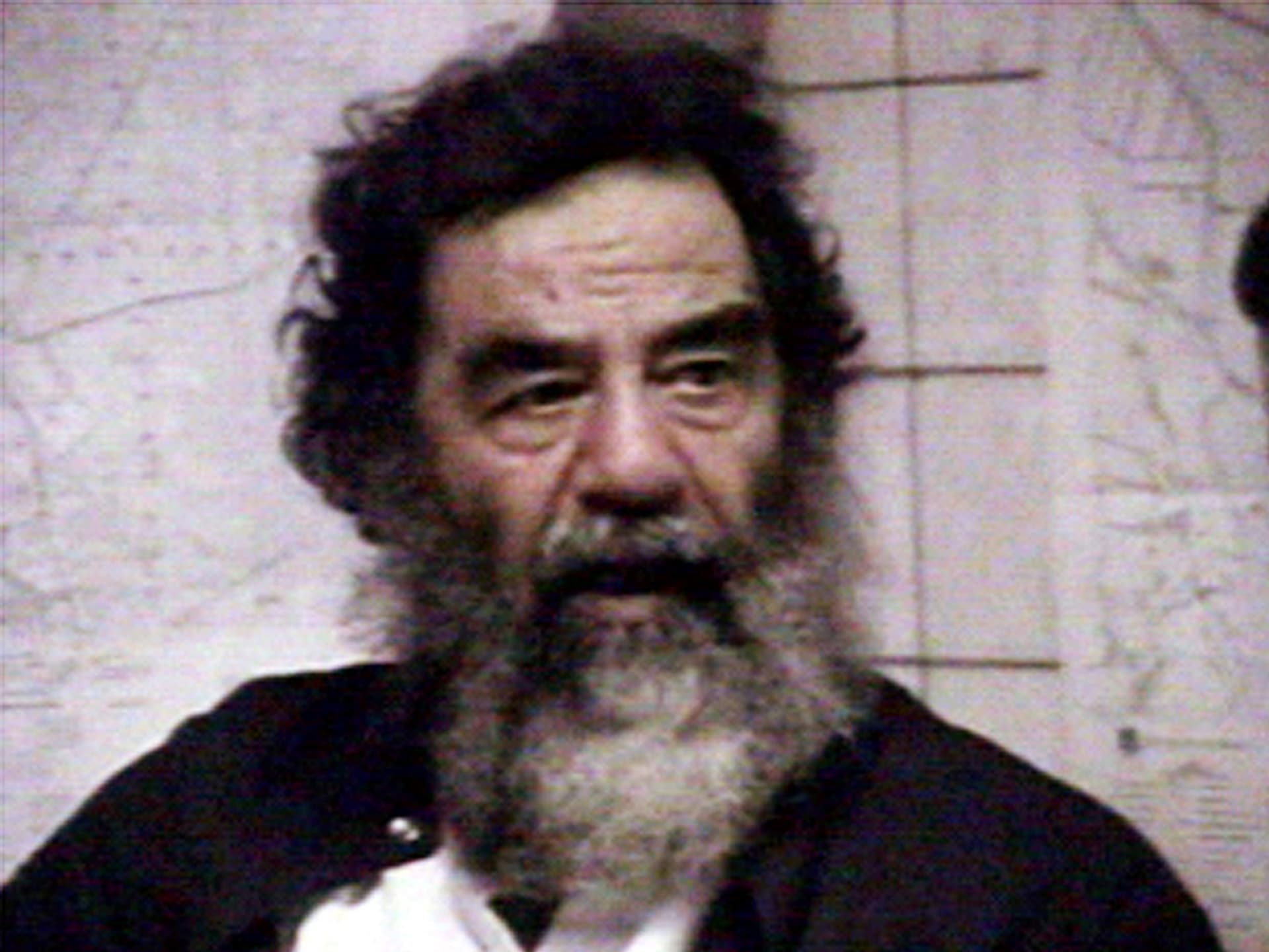 Saddam is filmed after his capture.
