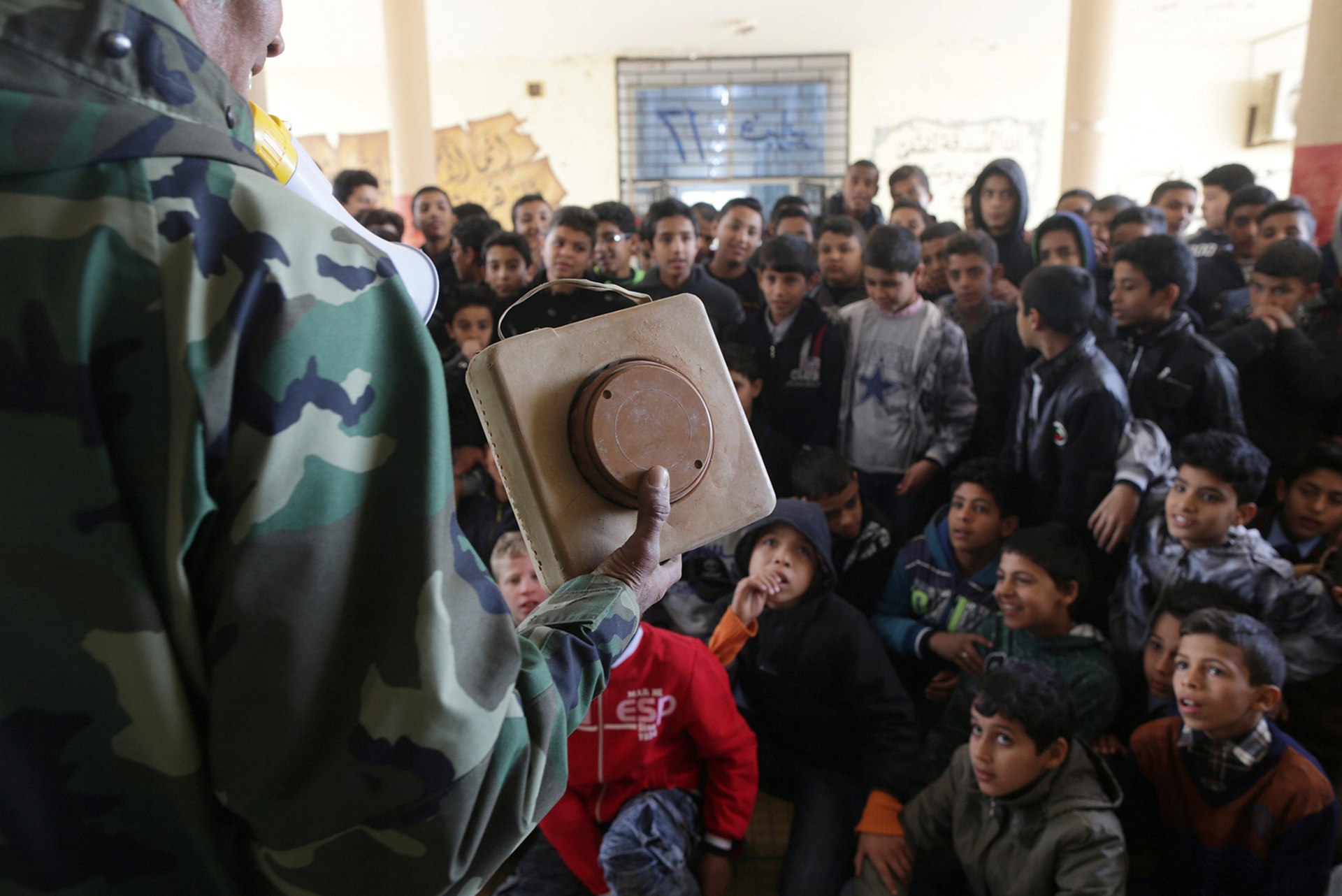 A member of the self-styled Libyan National Army gives a class aimed at raising awareness about mines and explosives to schoolboys in Benghazi, Libya on March 12, 2017