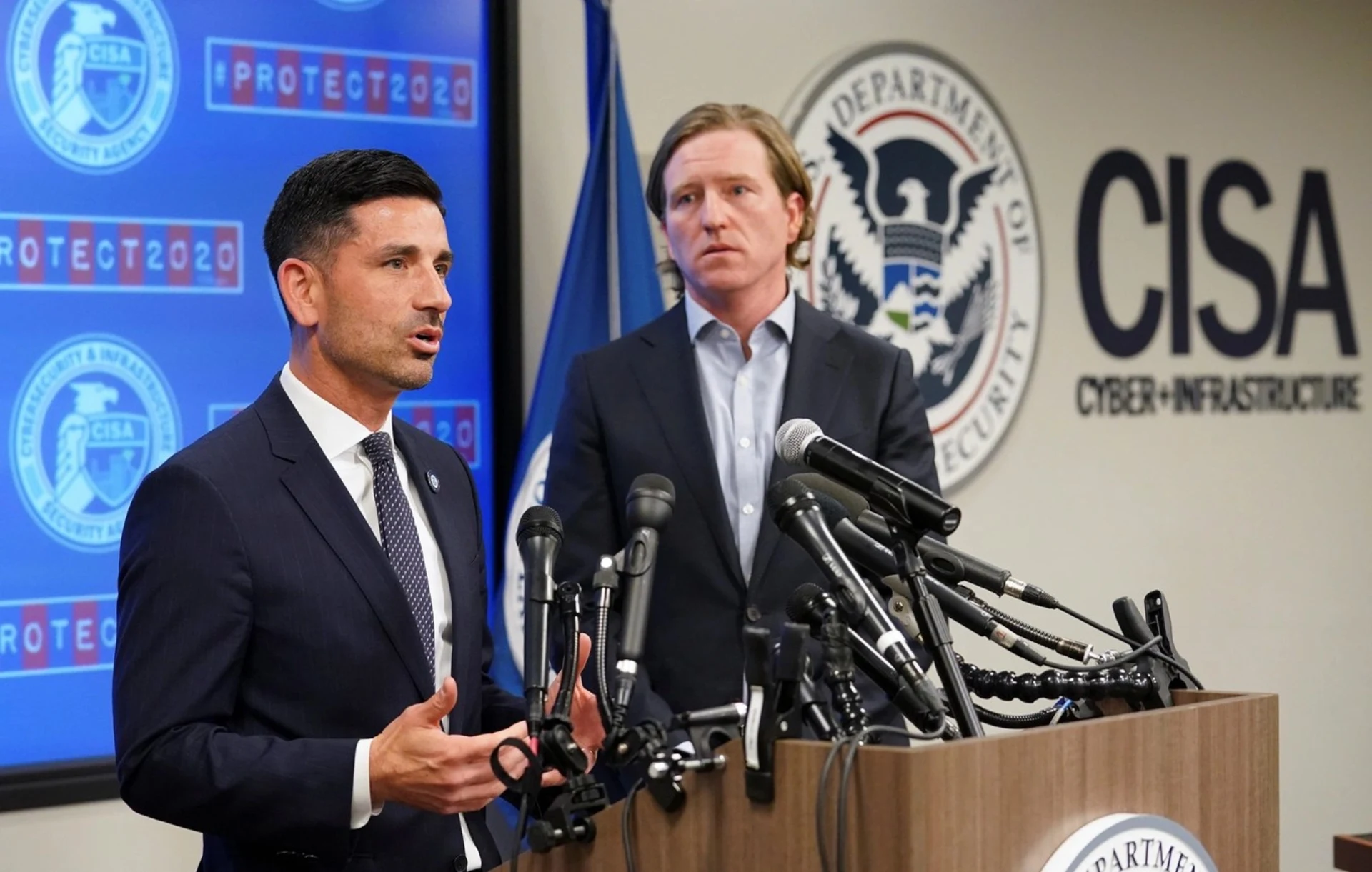Department of Homeland Security (DHS) Acting Secretary Chad Wolf (L) and Cybersecurity and Infrastructure Security Agency (CISA) Director Christopher Krebs speak to reporters at CISA’s Election Day Operation Center. 
