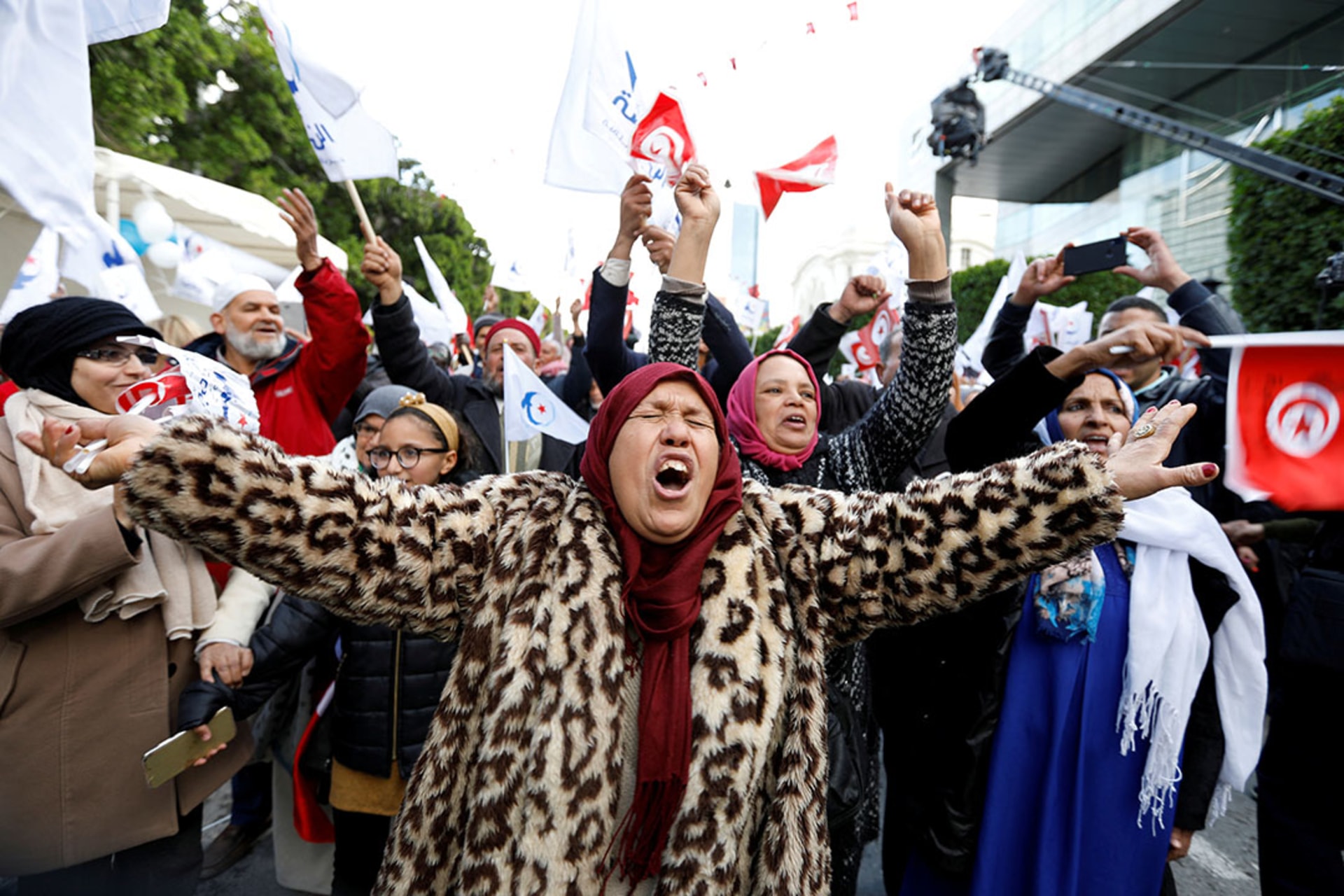 Women take part in a demonstration marking the eighth anniversary of the 2011 uprising that unseated President Zine al-Abidine Ben Ali.
