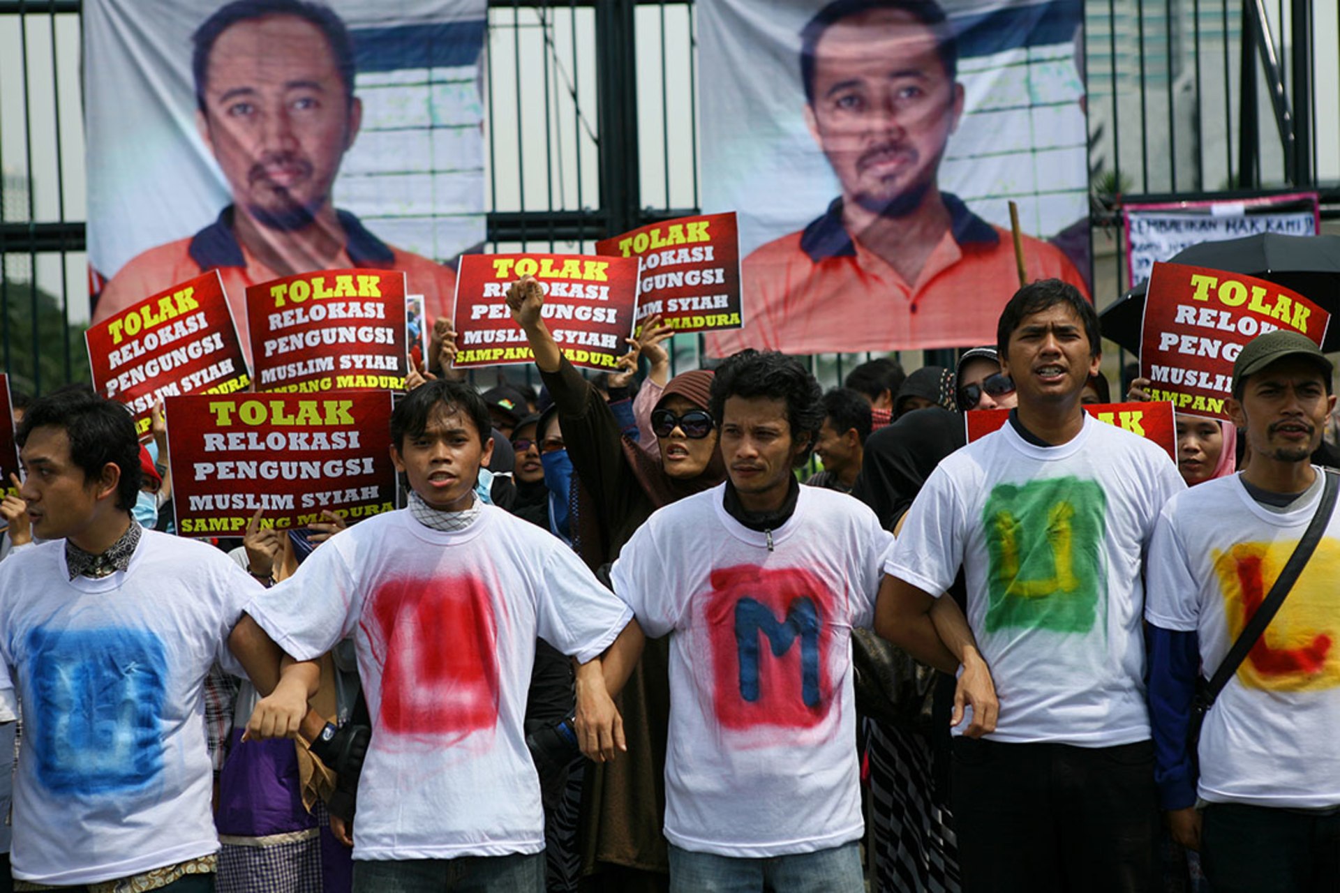 Indonesian Shias protest plans to relocate hundreds who had been driven from their village. 
