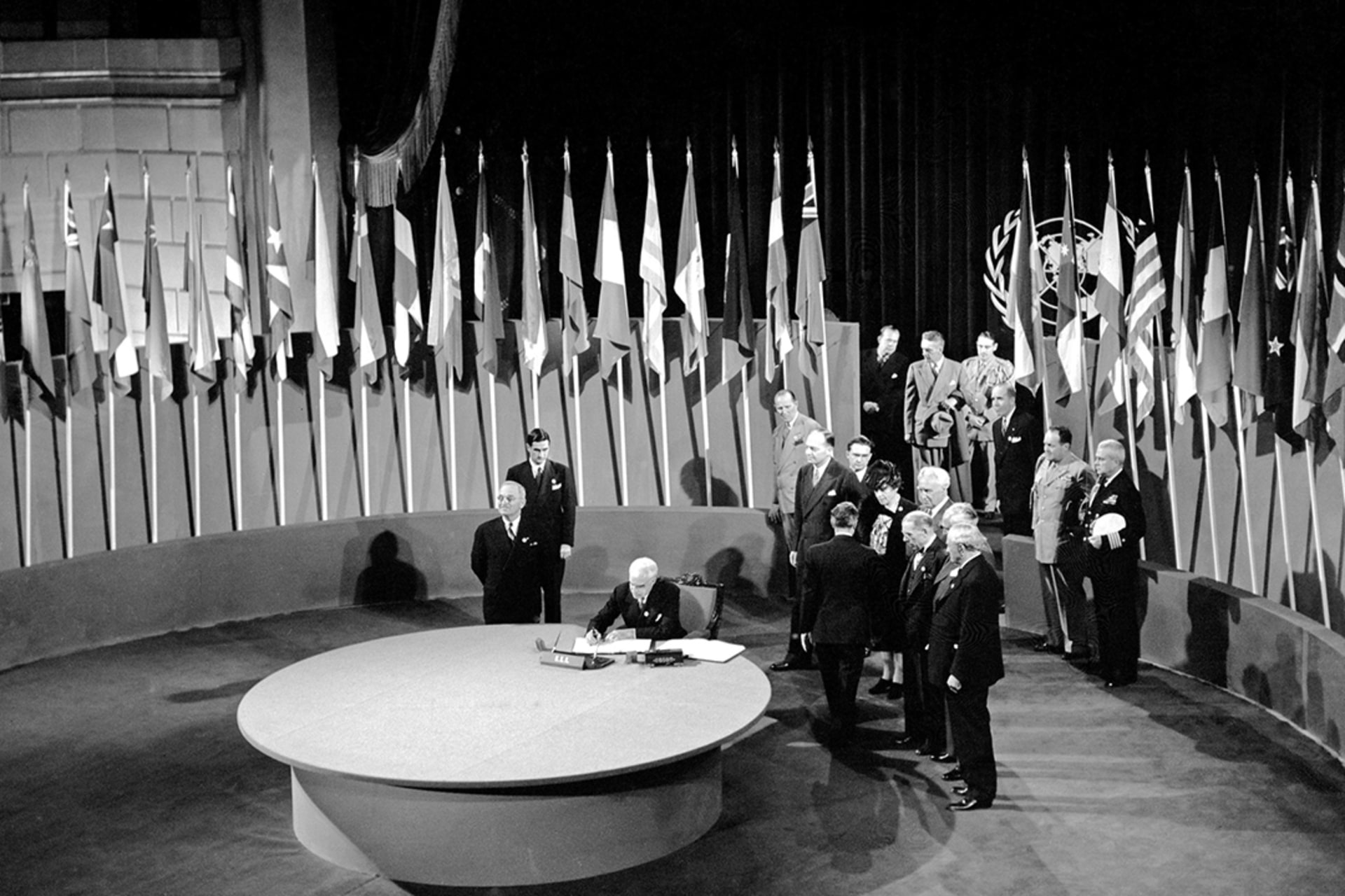 Secretary of State Edward Reilly Stettinius, Jr., chairman of the U.S. delegation, signs the UN Charter at a ceremony in San Francisco, California, June 26, 1945. Yould/UN Photo