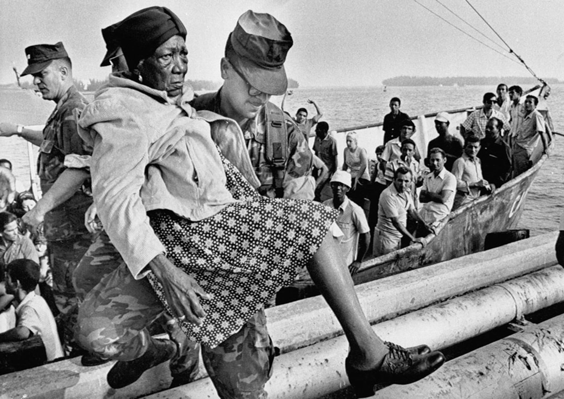 A U.S. Marine carries a Cuban refugee ashore. Bettmann/Getty Images