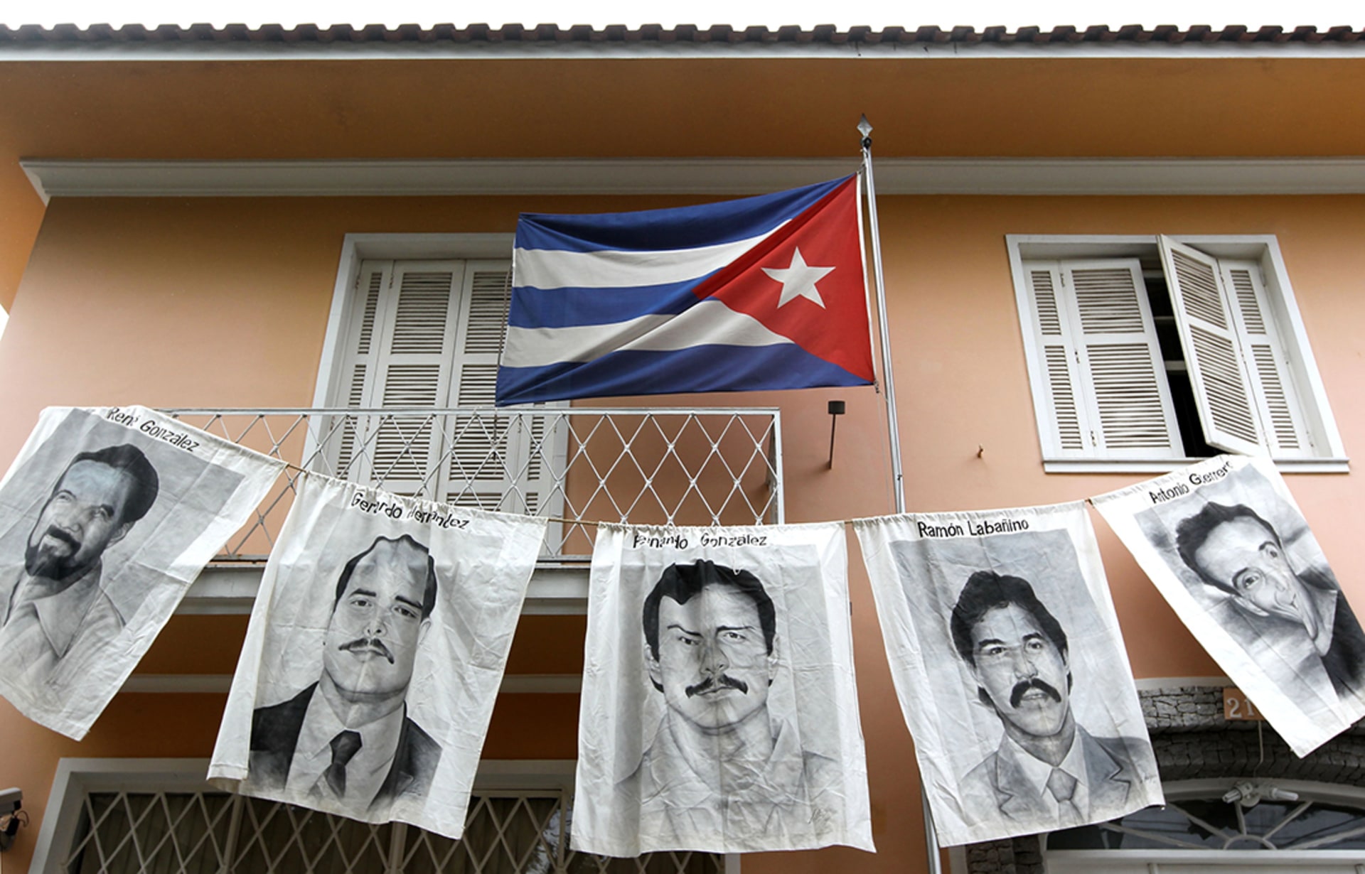 Posters of the five Cubans who were jailed in the United States are displayed in front of the Cuban Consulate in Sao Paulo, Brazil.