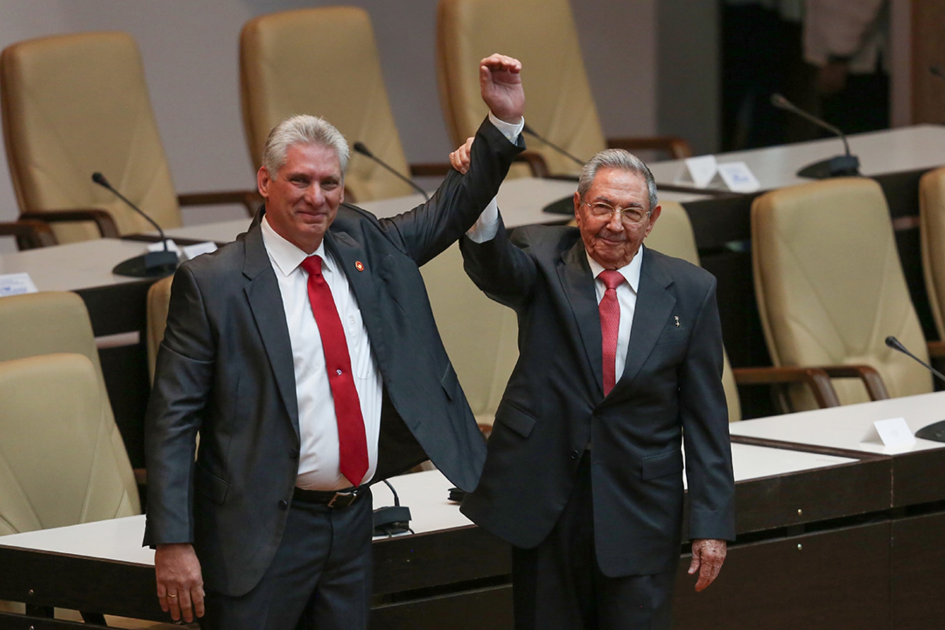 Former Cuban President Raul Castro celebrates with newly elected President Miguel Diaz-Canel, April 19, 2018.