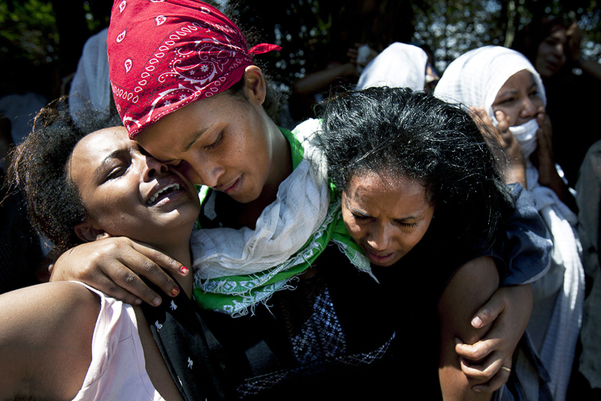 Family members mourn during a memorial service for Eritreans killed in twin bombings in Kampala.Reuters