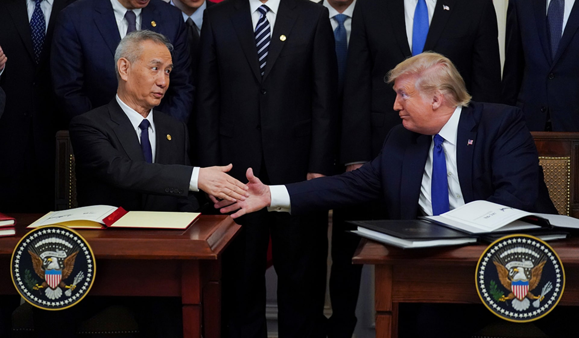 Chinese Vice Premier Liu He and U.S. President Donald Trump shake hands after signing the “phase one” deal. 
