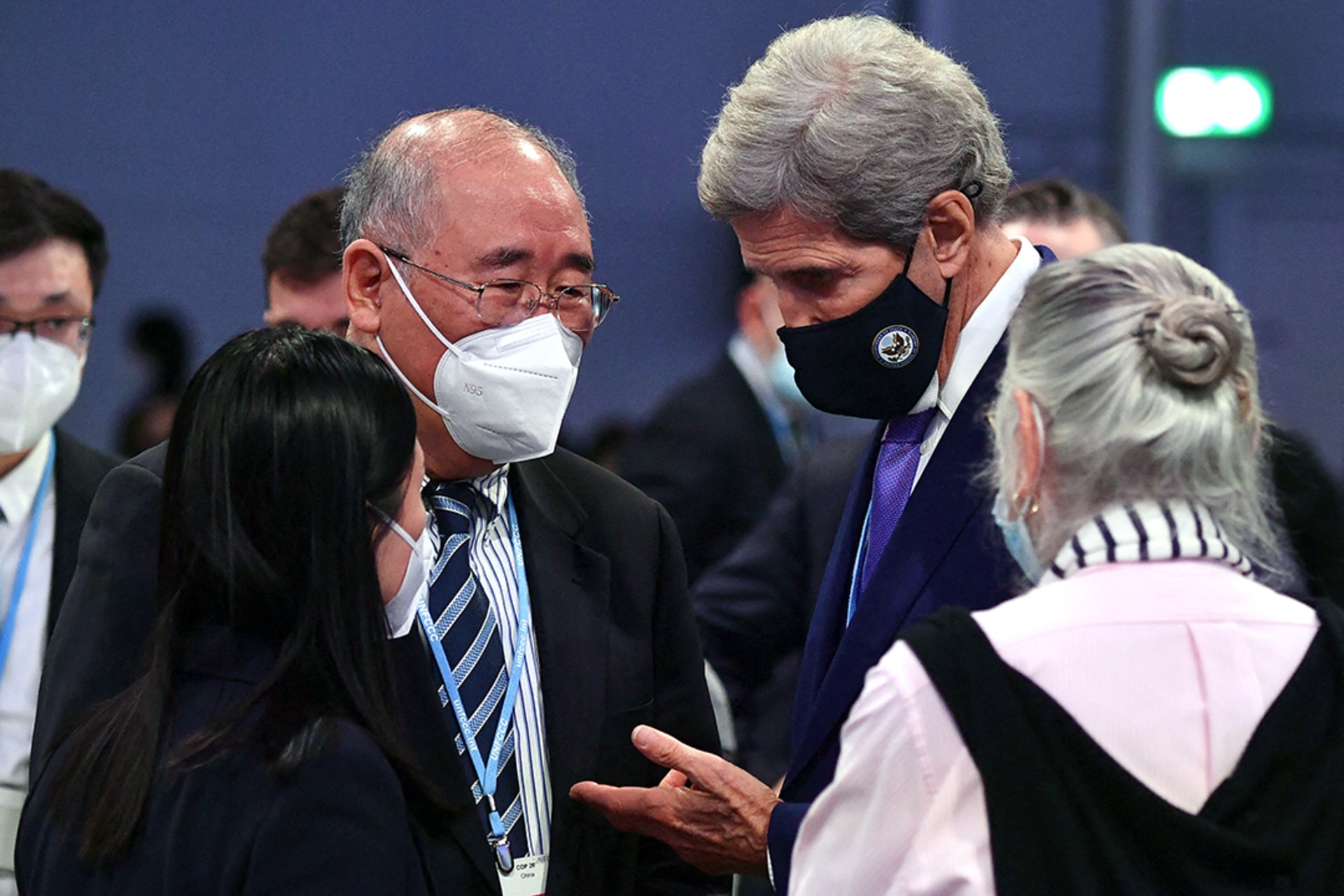 U.S. climate envoy John Kerry speaks with his Chinese counterpart, Xie Zhenhua, at the twenty-sixth UN Conference of the Parties (COP26) in Glasgow. 
