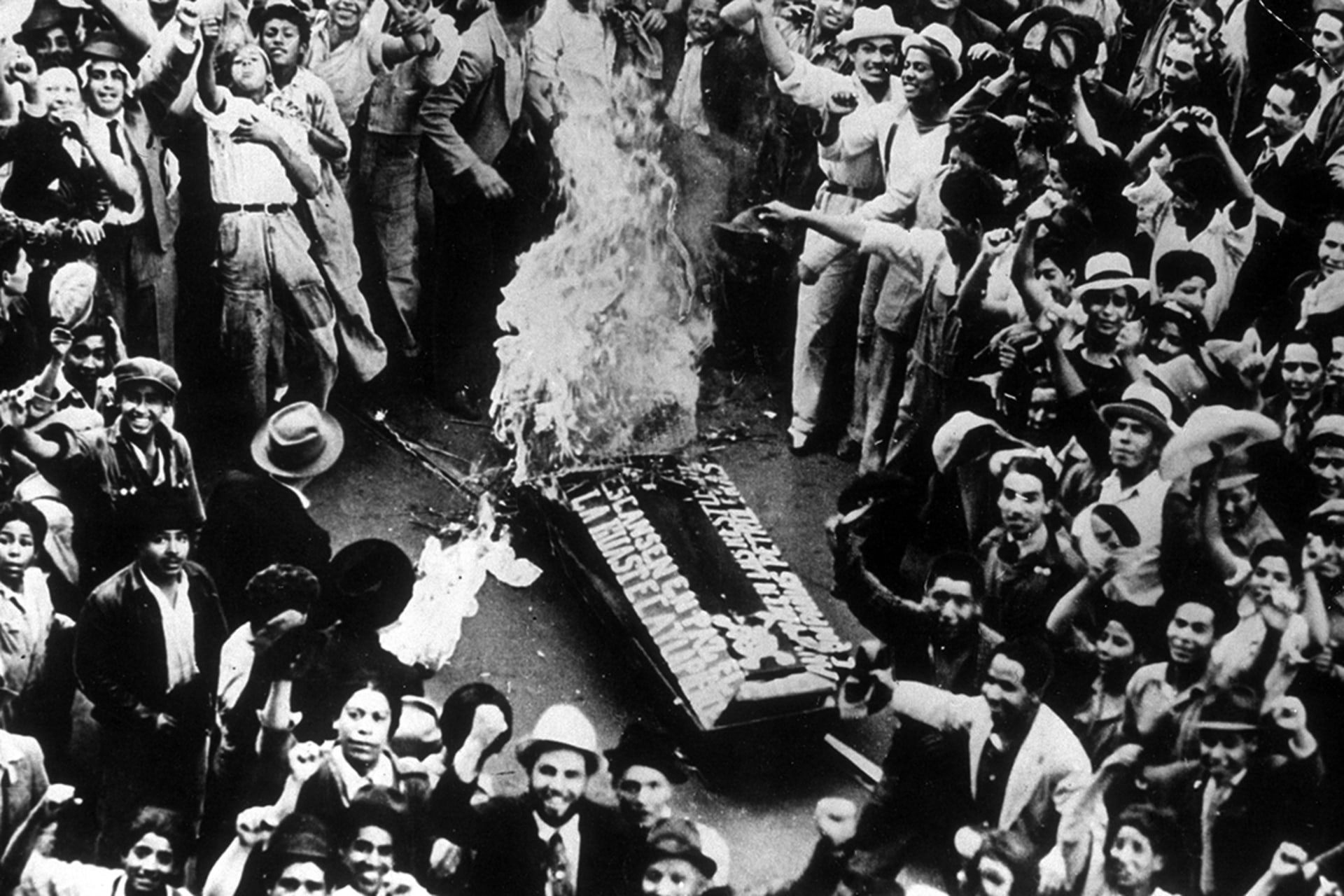 Residents of Mexico City celebrating appropriation of foreign oil companies, 1938.
