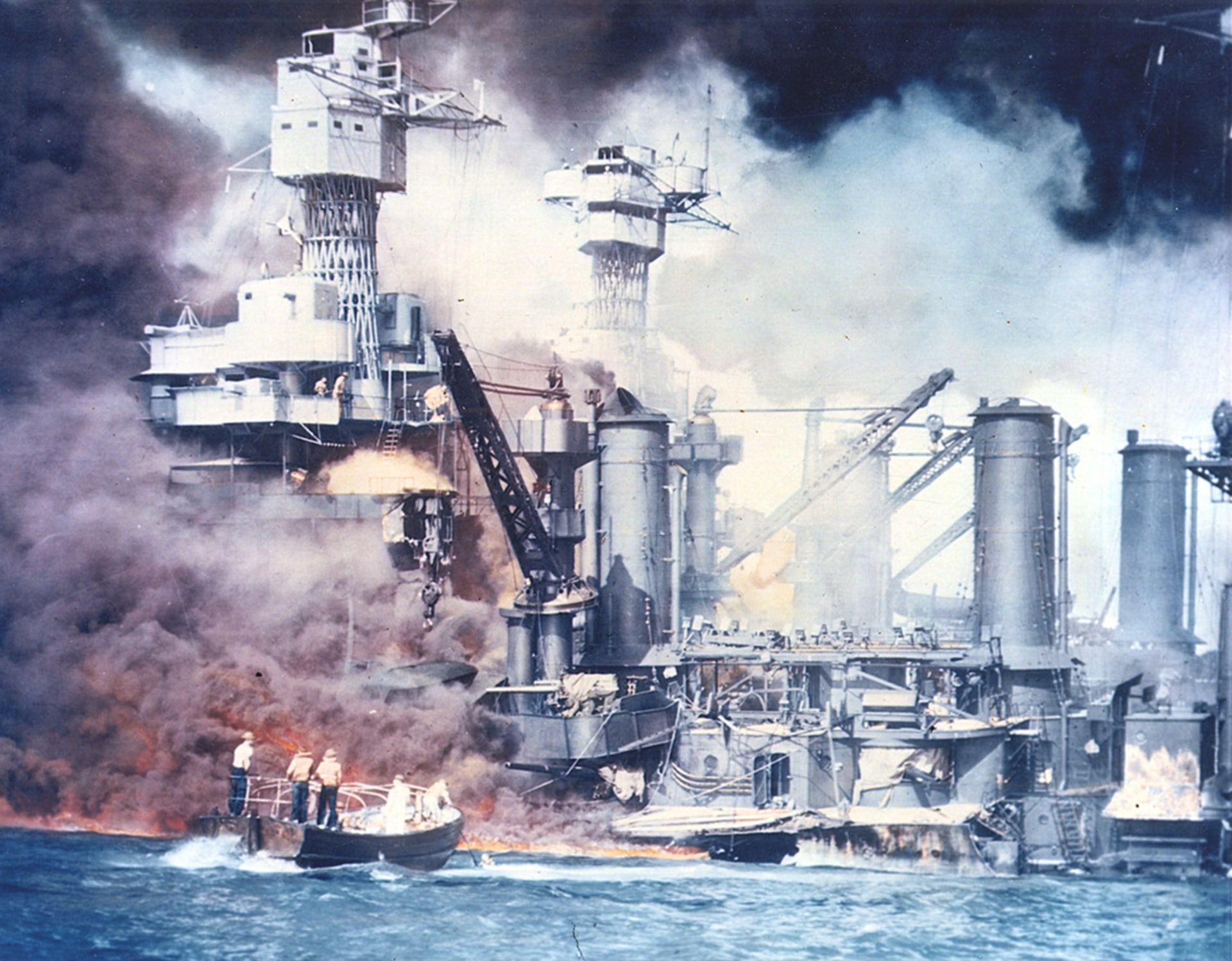U.S. warships burn following the Japanese surprise attack on Pearl Harbor, Hawaii, on December 7, 1941. 
