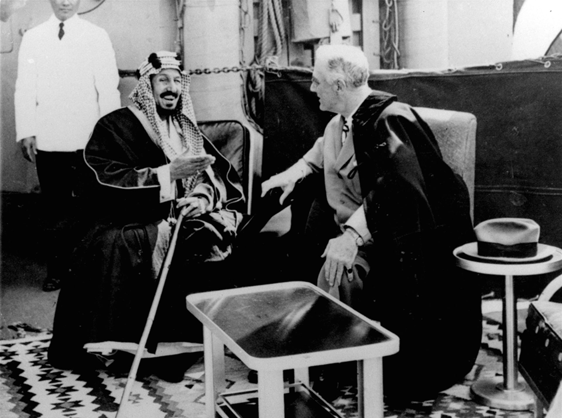 U.S. President Franklin D. Roosevelt and King Abdul Aziz Ibn Saud in discussion aboard the USS Quincy north of Suez, Egypt, on February 14, 1945. 
