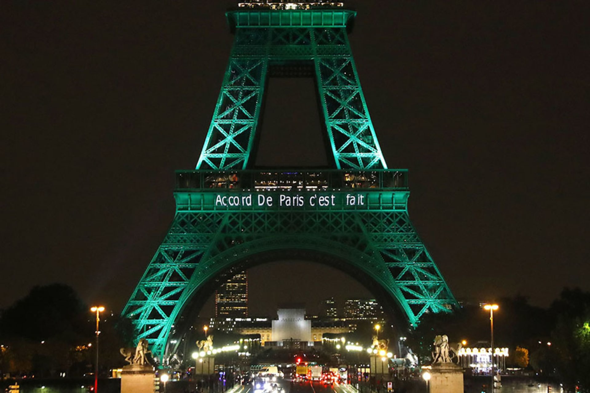 The Eiffel Tower is illuminated to celebrate the first day of the application of the Paris climate accord. 
