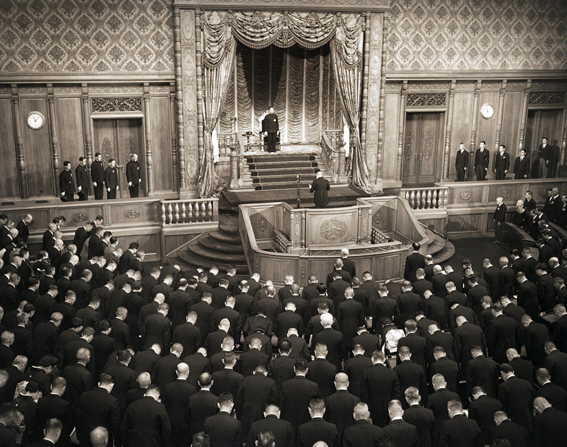 Emperor Hirohito stands before the Japanese Diet to endorse the new constitution.