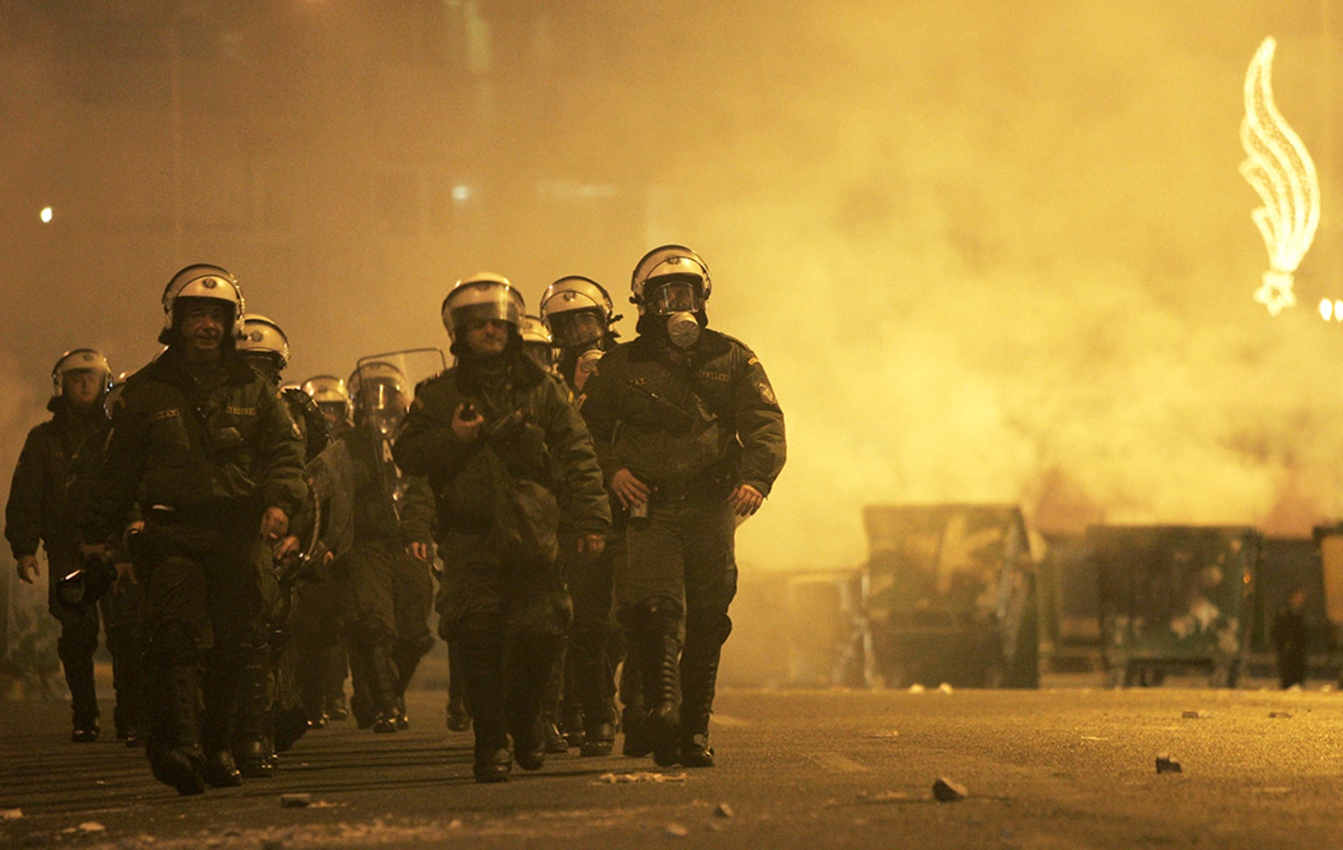 Riot police respond to protests against the privatization of the Port of Piraeus in January 2008, set to be auctioned off to raise funds for the struggling Greek state. 
