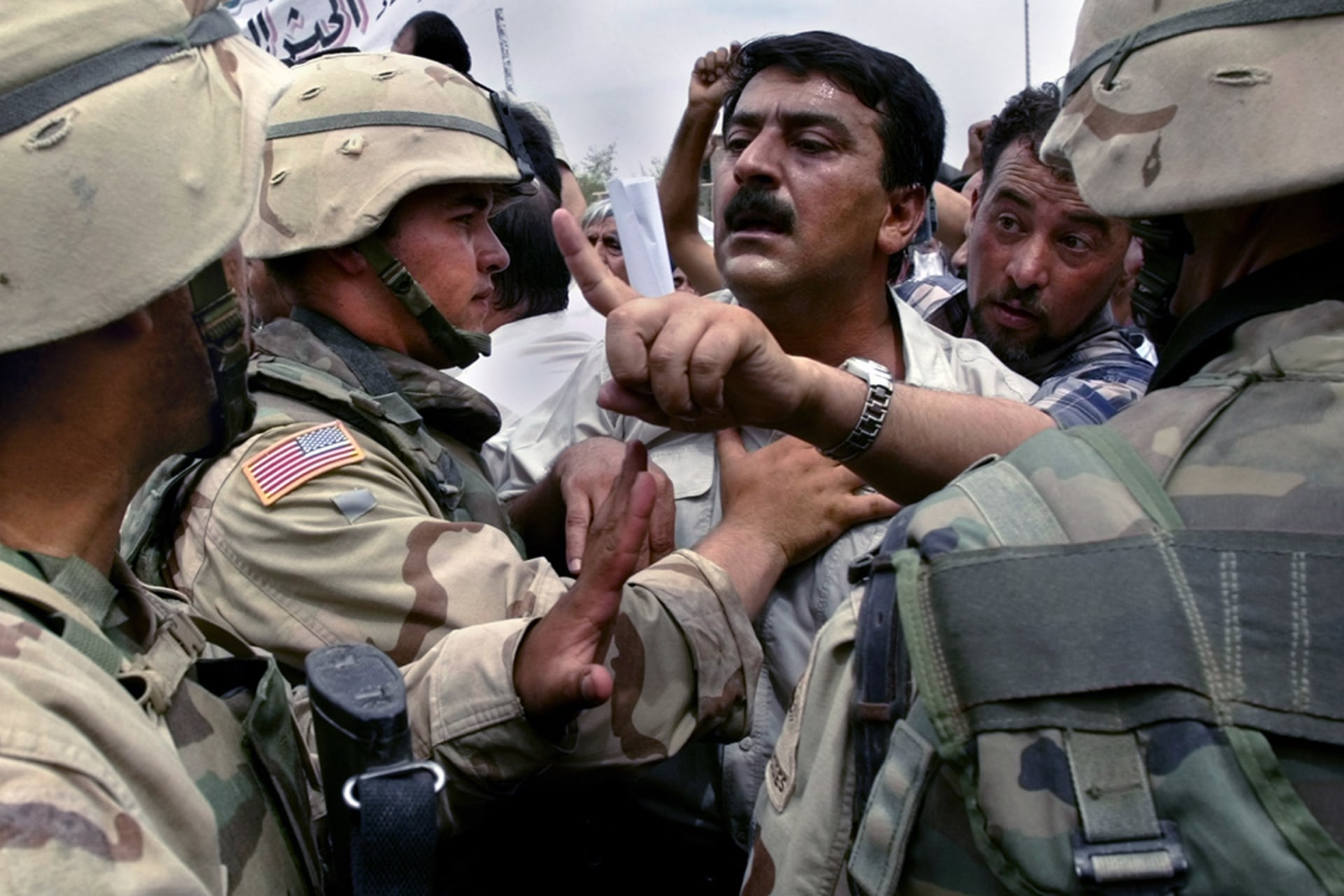 Soldiers from the disbanded Iraqi army protest their dismissal near the headquarters of the U.S.-led administration in Baghdad.