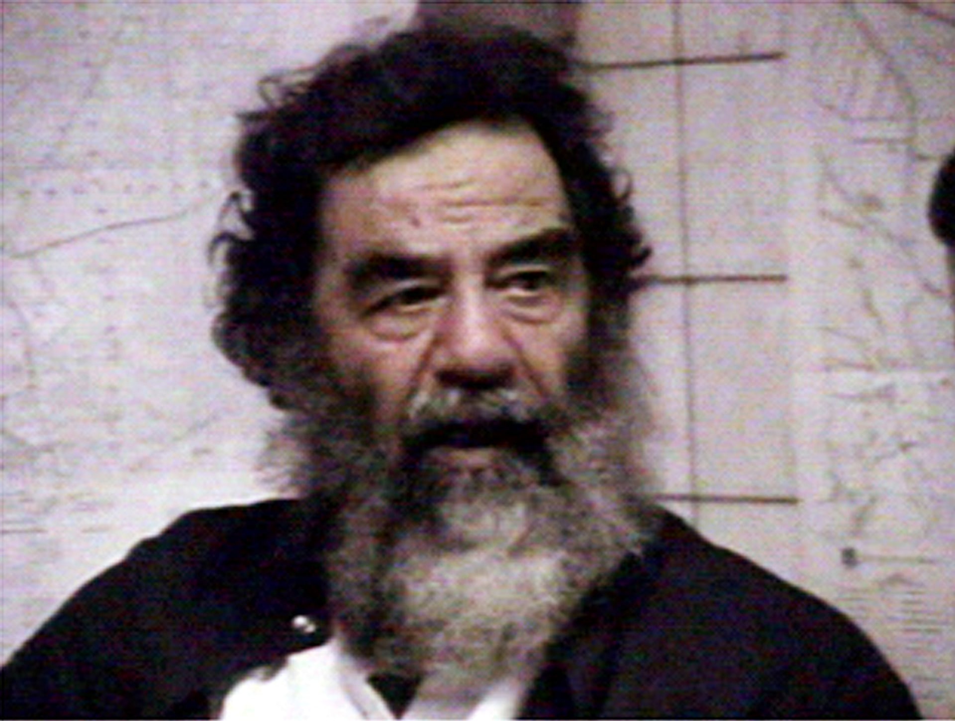 Saddam is filmed after his capture.