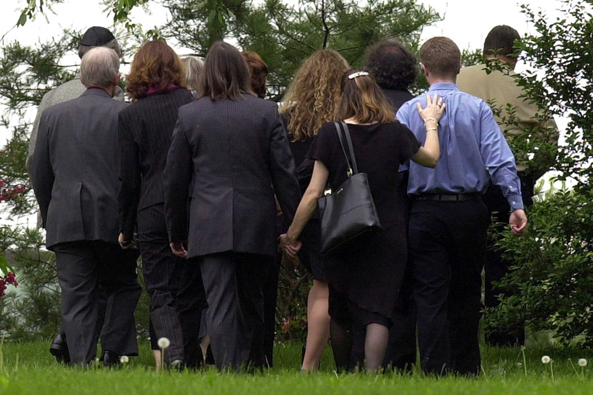 Family members of slain American Nicholas Berg stand at his memorial service in West Chester, Pennsylvania.