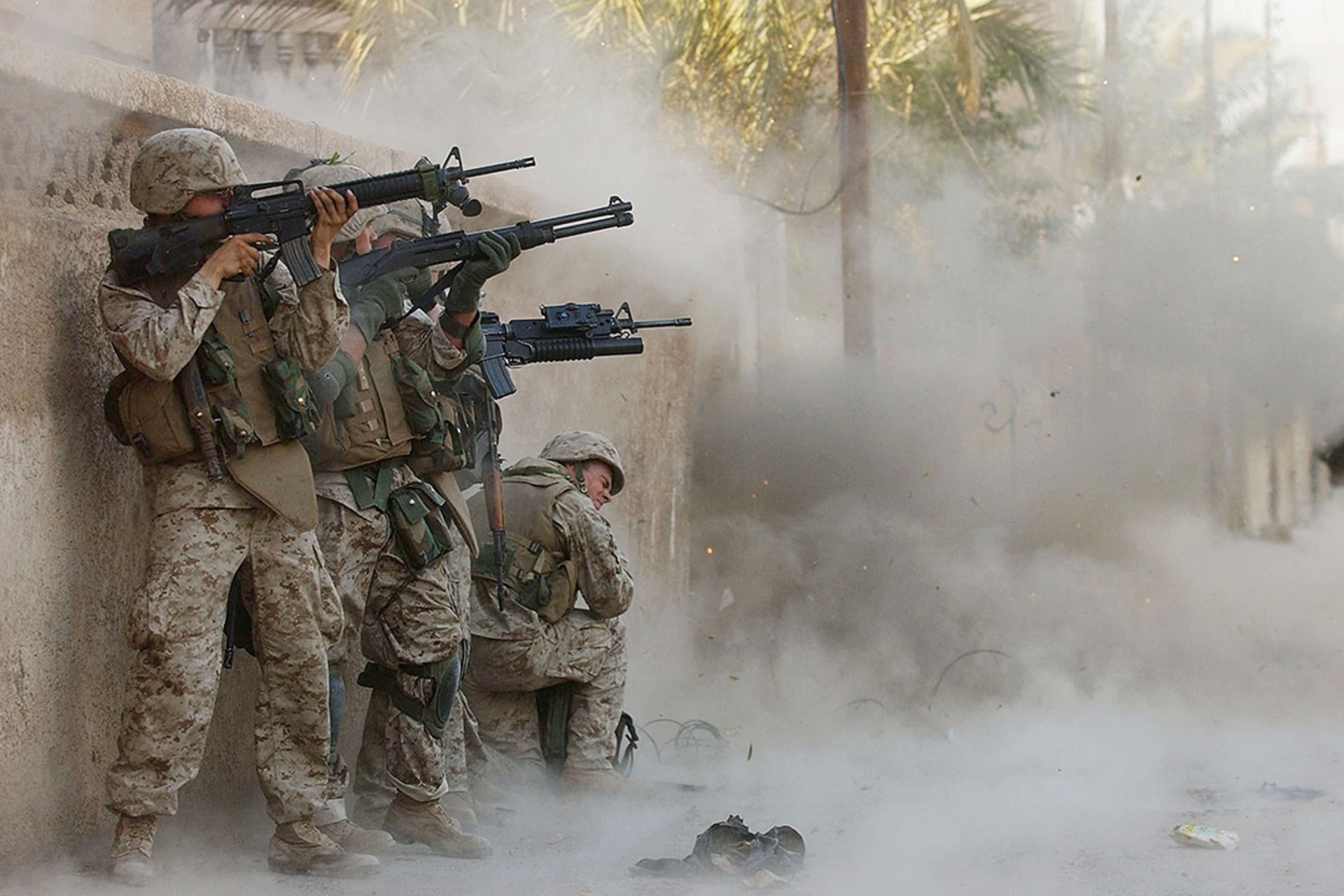 U.S. marines blast open a metal gate during a house-to-house search for insurgents in Fallujah in November 2004.